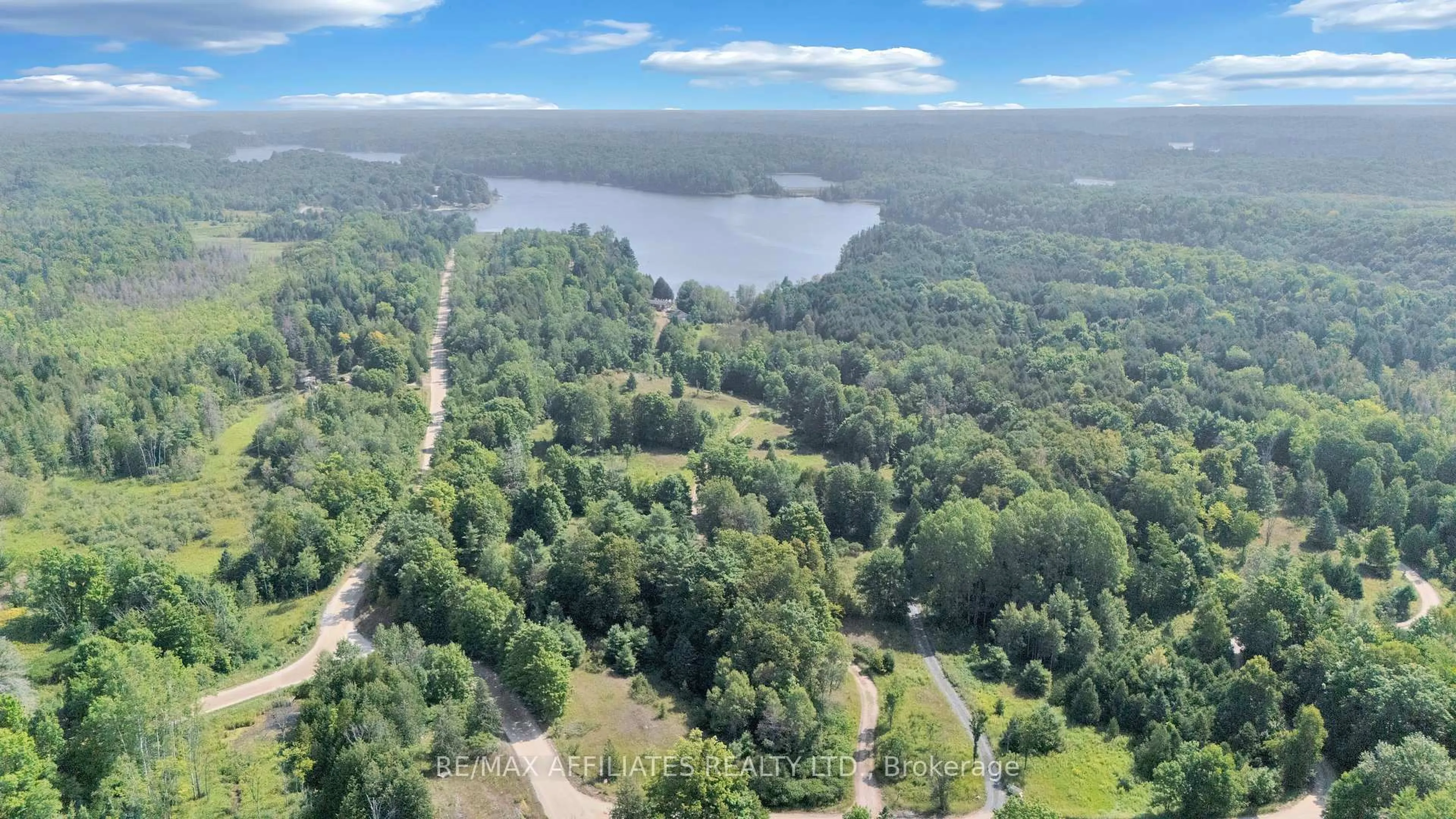 A pic from outside/outdoor area/front of a property/back of a property/a pic from drone, water/lake/river/ocean view for 1009 Gardiner's Rd, Arden Ontario K0H 1B0