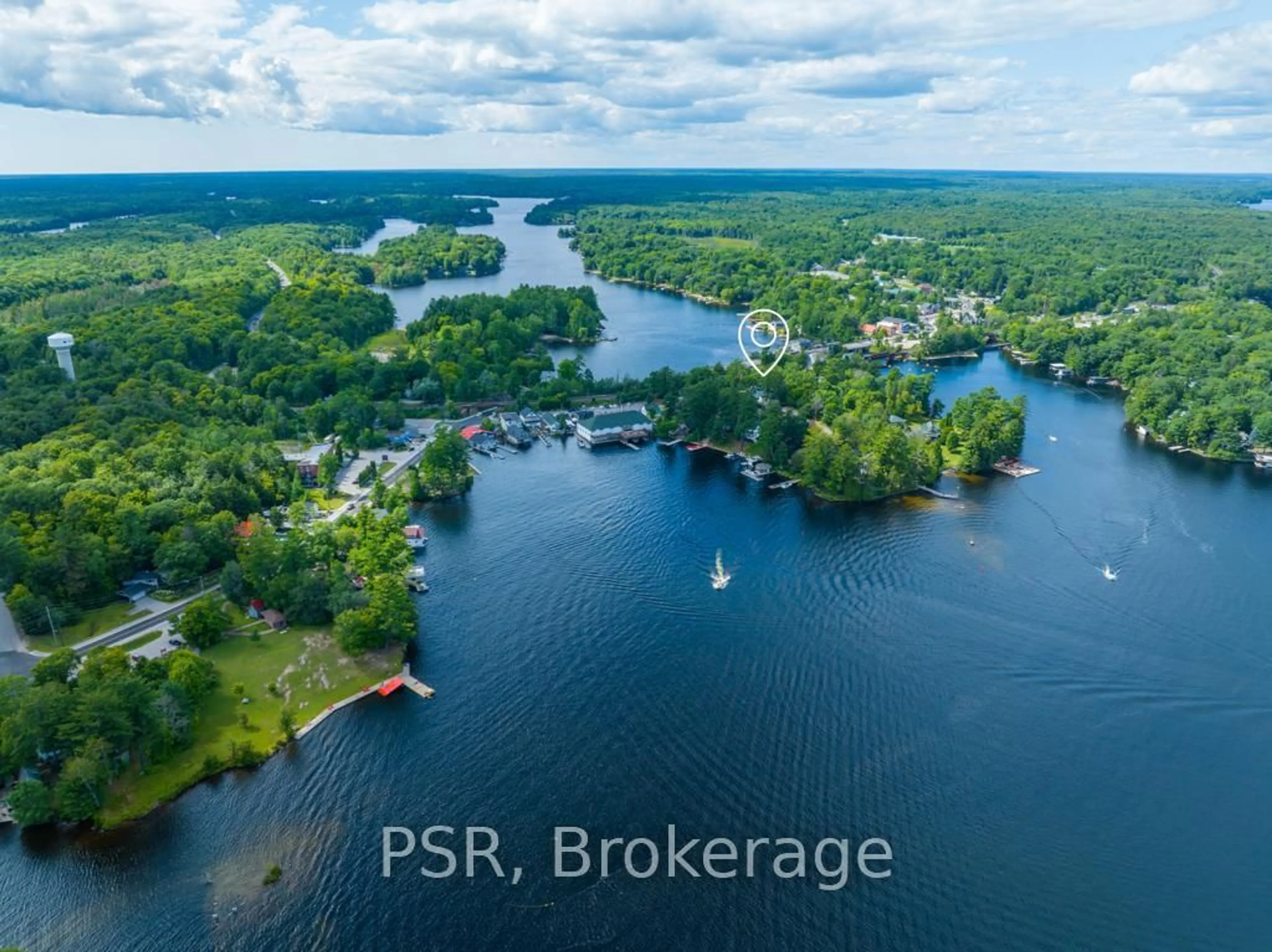 A pic from outside/outdoor area/front of a property/back of a property/a pic from drone, water/lake/river/ocean view for 1020 Bala Falls Rd, Muskoka Lakes Ontario P0C 1A0