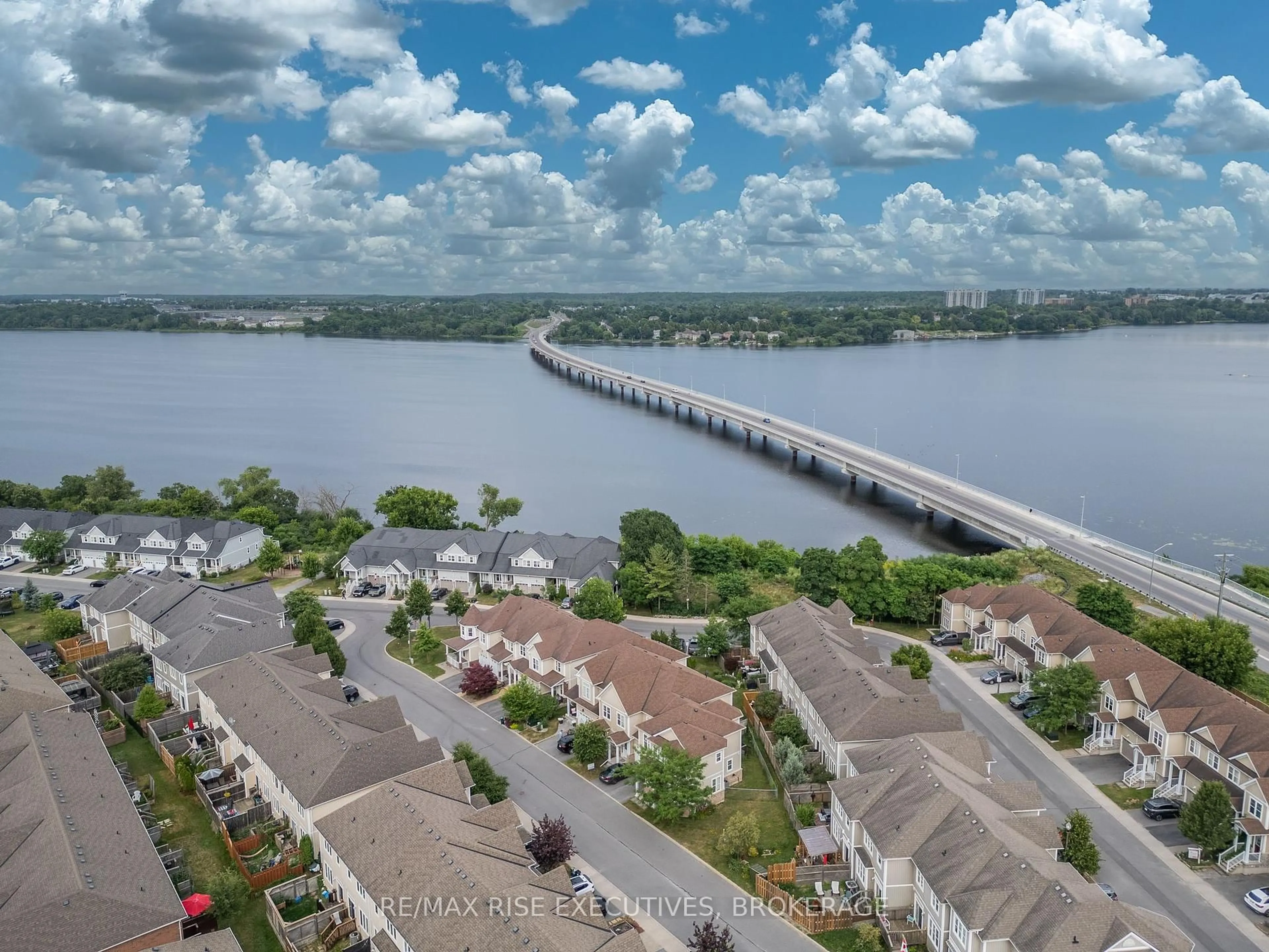 A pic from outside/outdoor area/front of a property/back of a property/a pic from drone, water/lake/river/ocean view for 903 Ascot Lane, Kingston Ontario K7K 0C8