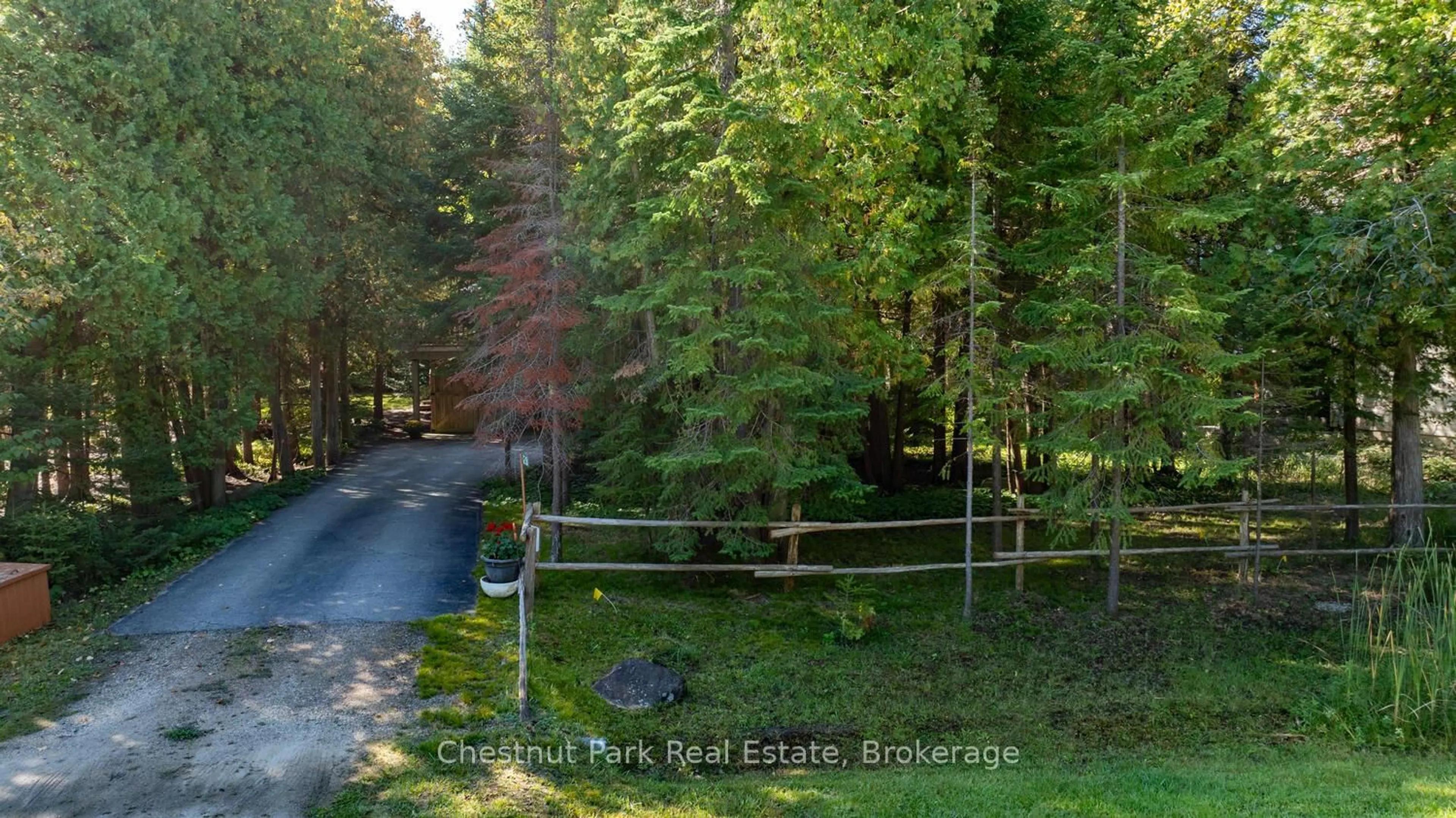 A pic from outside/outdoor area/front of a property/back of a property/a pic from drone, forest/trees view for 128 Lakewood Dr, Blue Mountains Ontario N0H 1J0