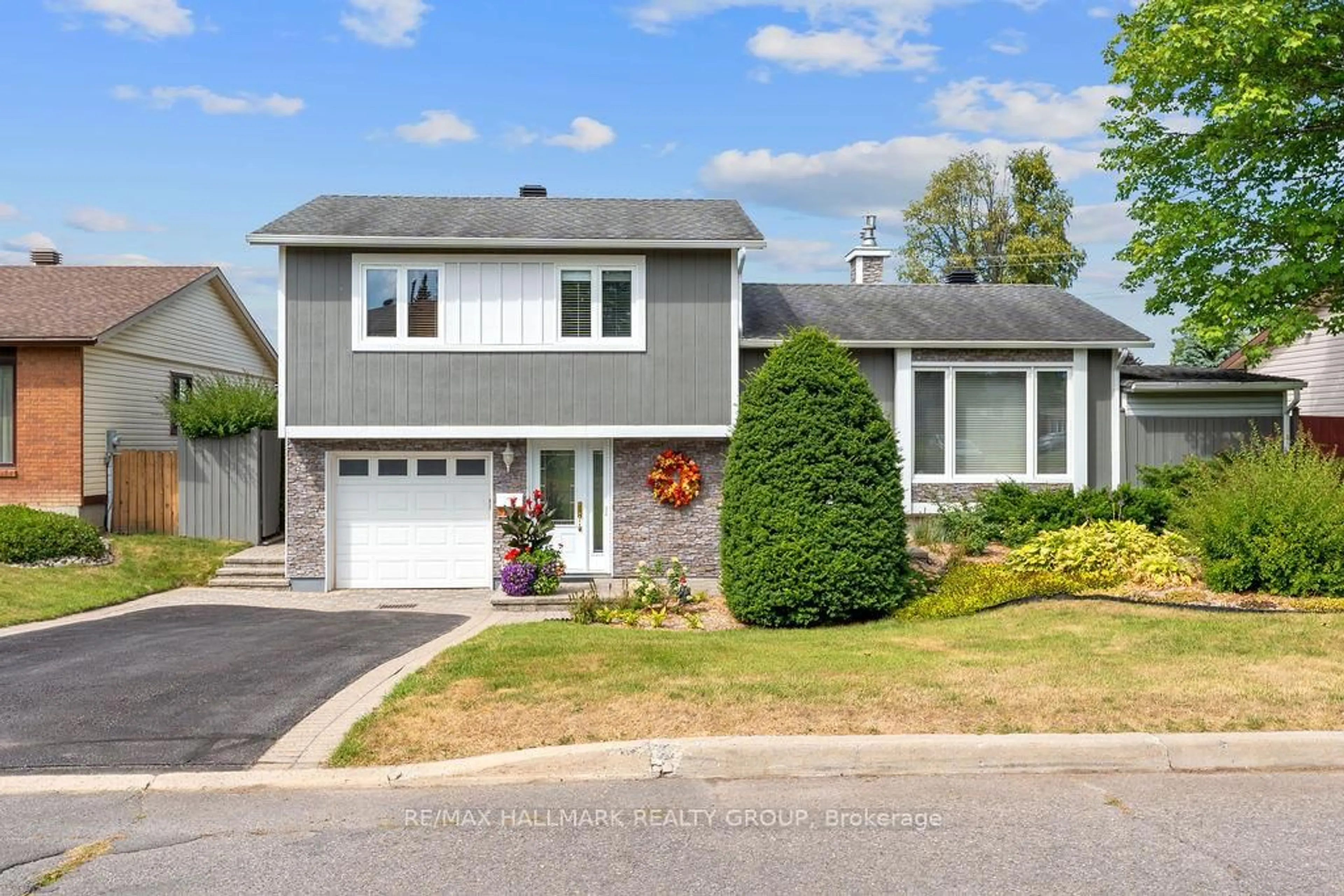 Home with vinyl exterior material, street for 1570 Marcoux Dr, Orleans Ontario K1E 2J9