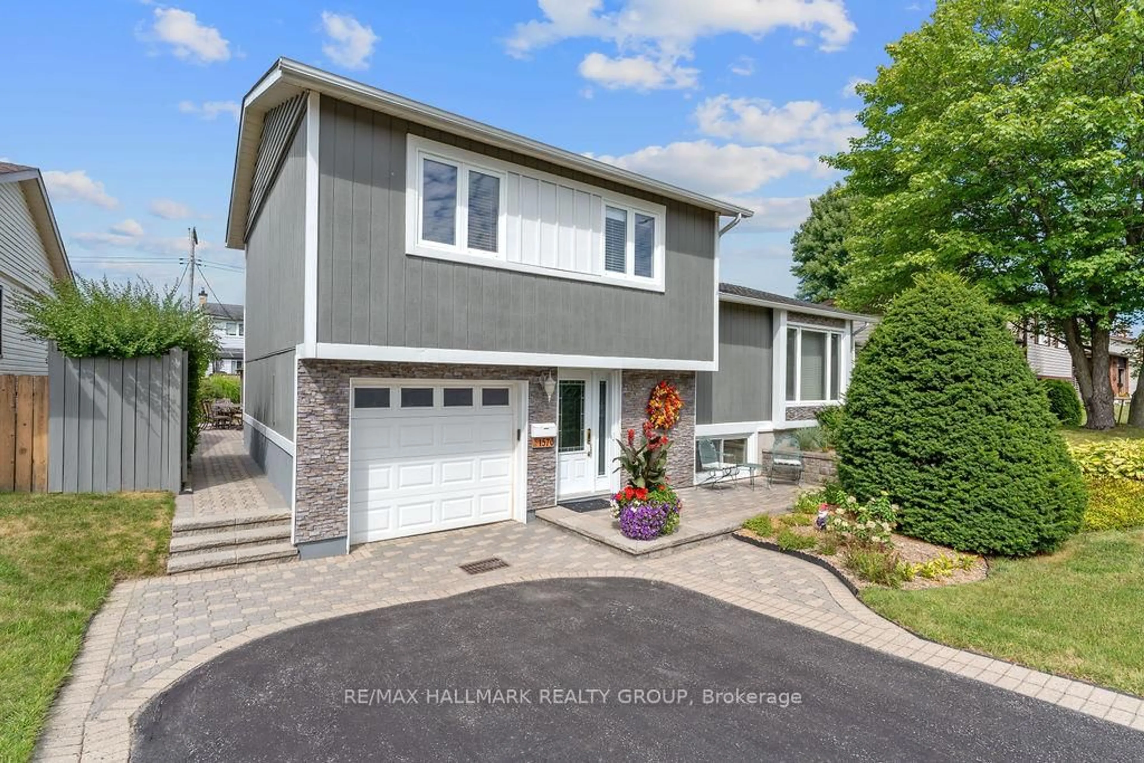 Home with vinyl exterior material, street for 1570 Marcoux Dr, Orleans Ontario K1E 2J9