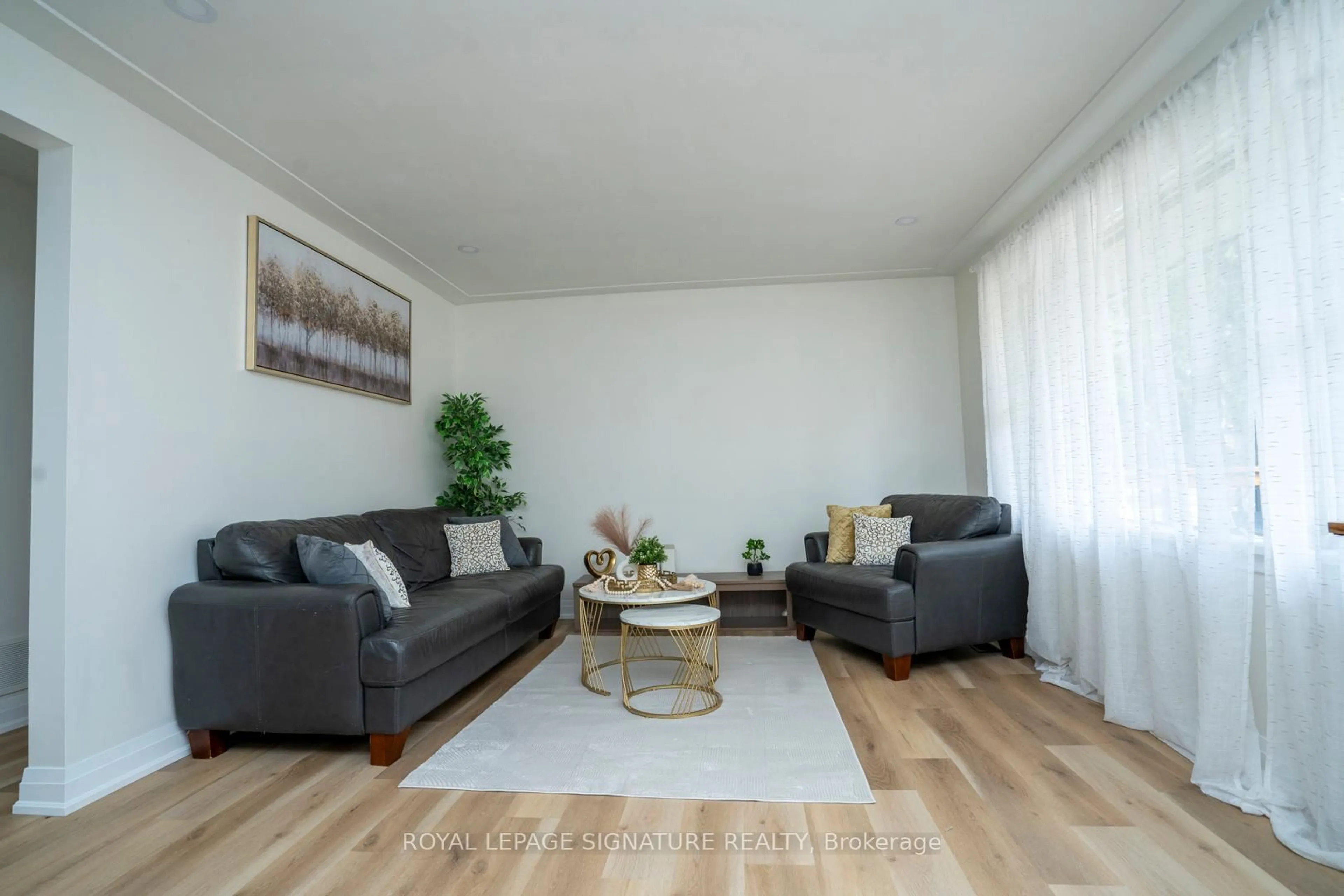 Living room with furniture, wood/laminate floor for 61 Broadmoor Ave, Kitchener Ontario N2C 1Y6
