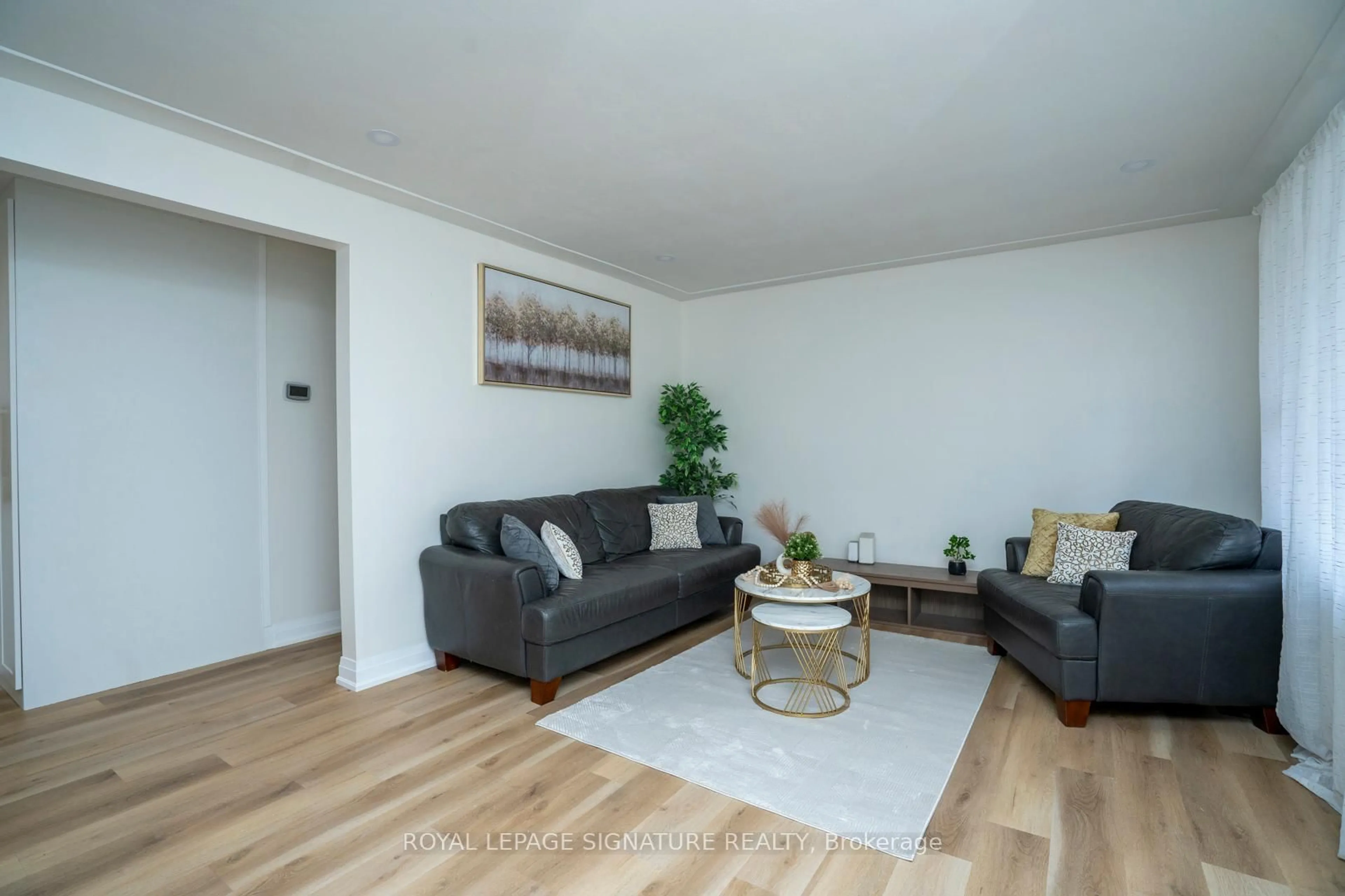 Living room with furniture, wood/laminate floor for 61 Broadmoor Ave, Kitchener Ontario N2C 1Y6