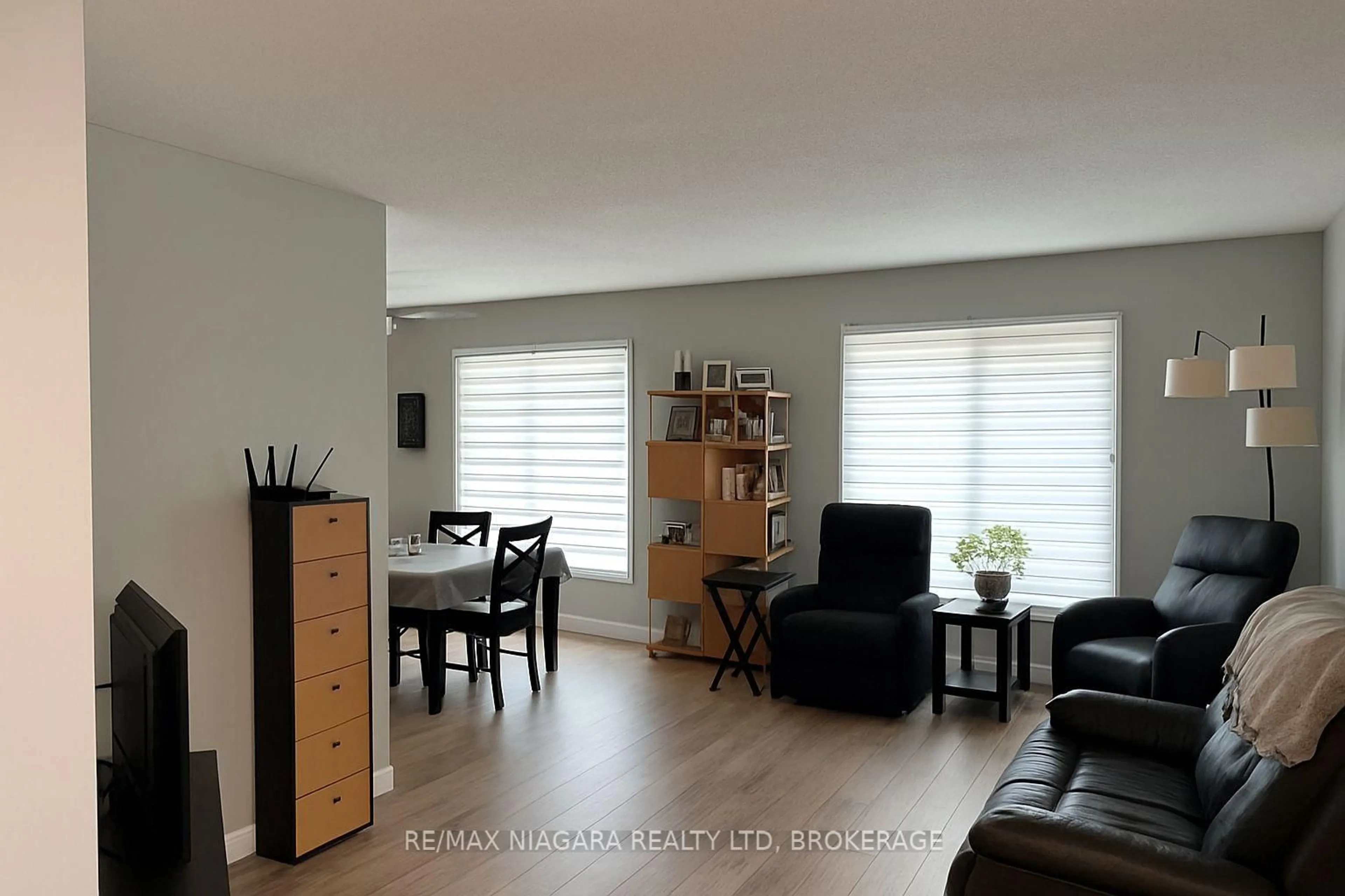 Living room with furniture, wood/laminate floor for 6516 Monroe St, Niagara Falls Ontario L2G 2G8