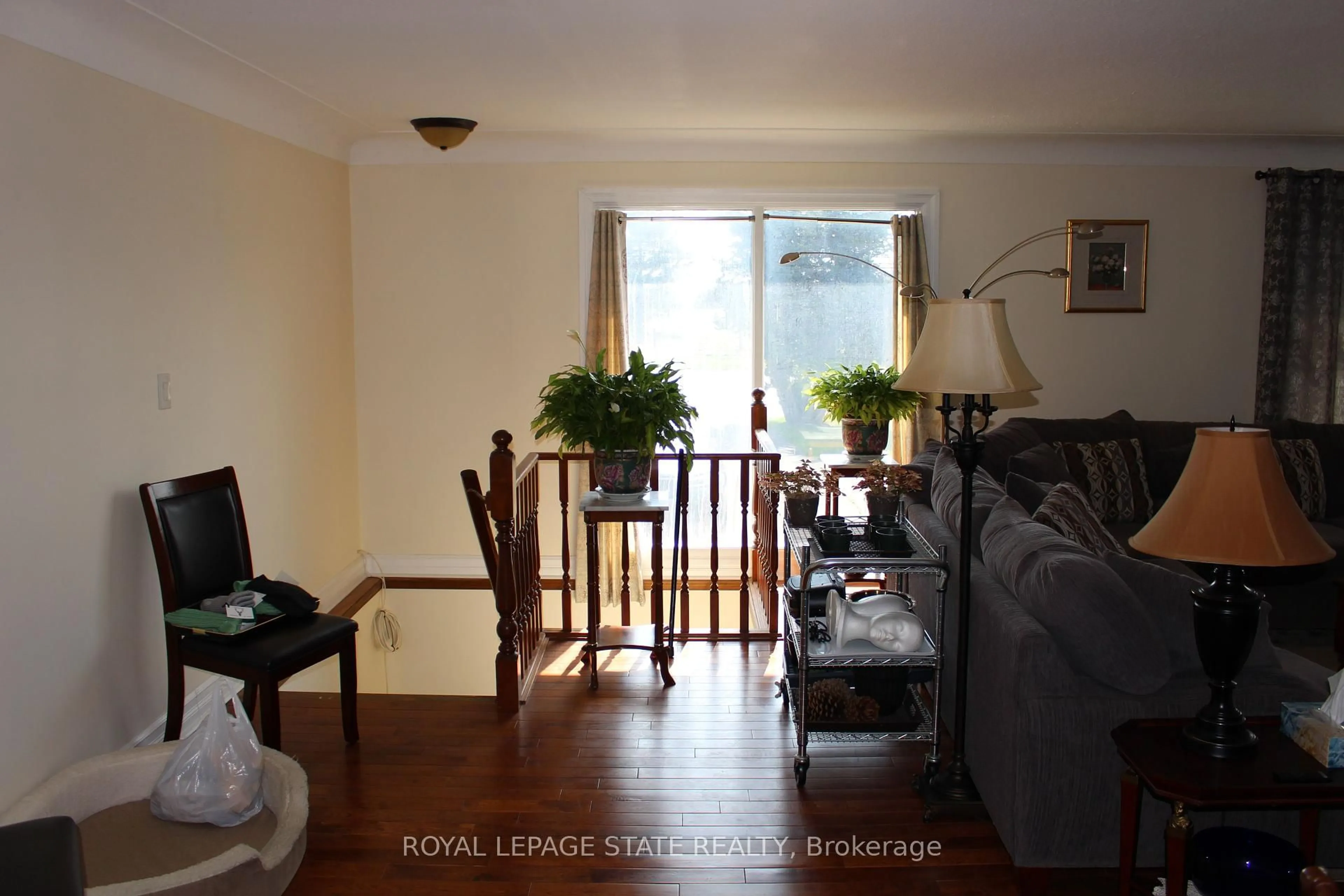 Living room with furniture, wood/laminate floor for 2112 Upper James St, Hamilton Ontario L0R 1W0