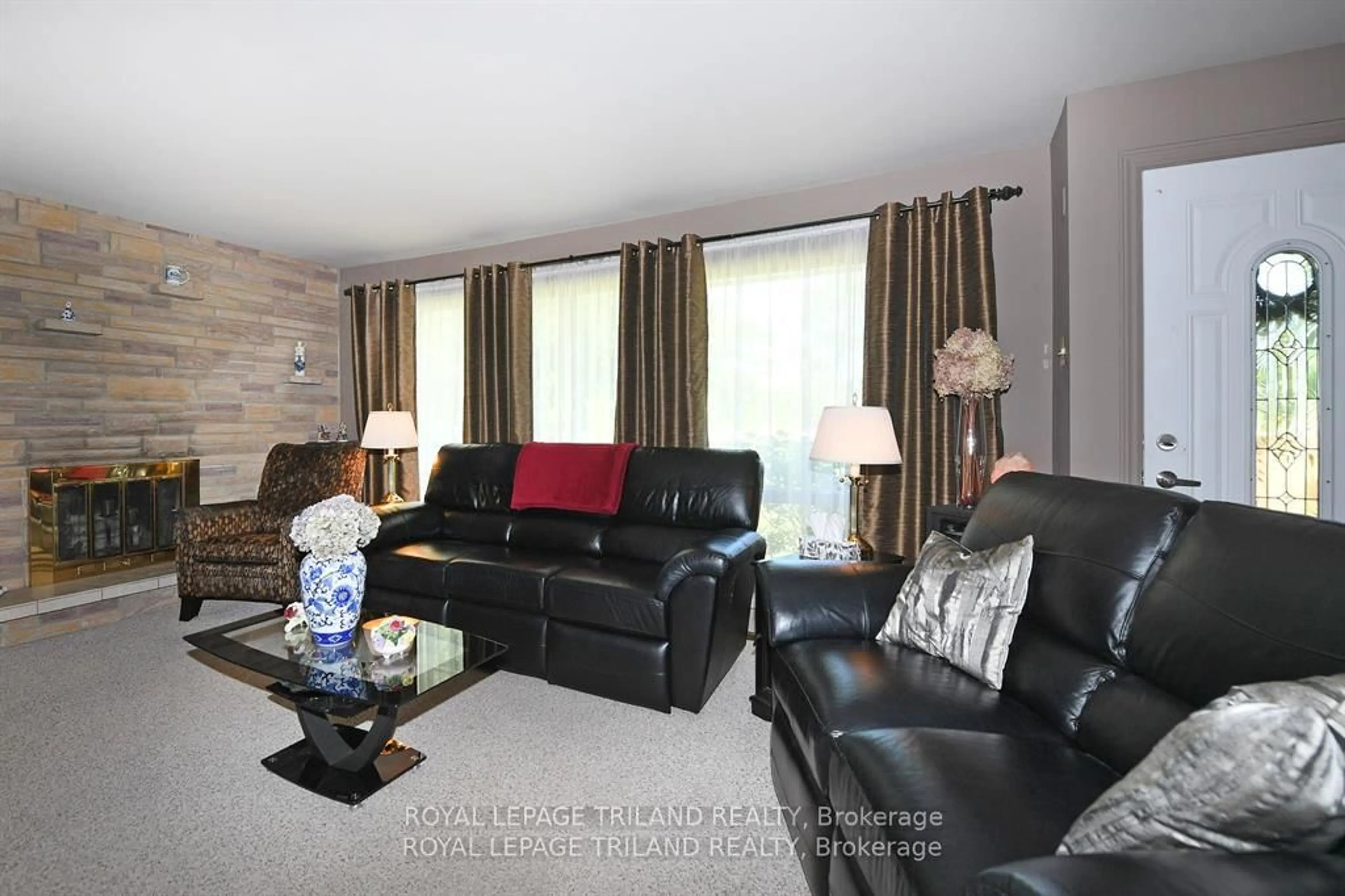 Living room with furniture, wood/laminate floor for 5103 Dundas St, Middlesex Centre Ontario N0M 2P0