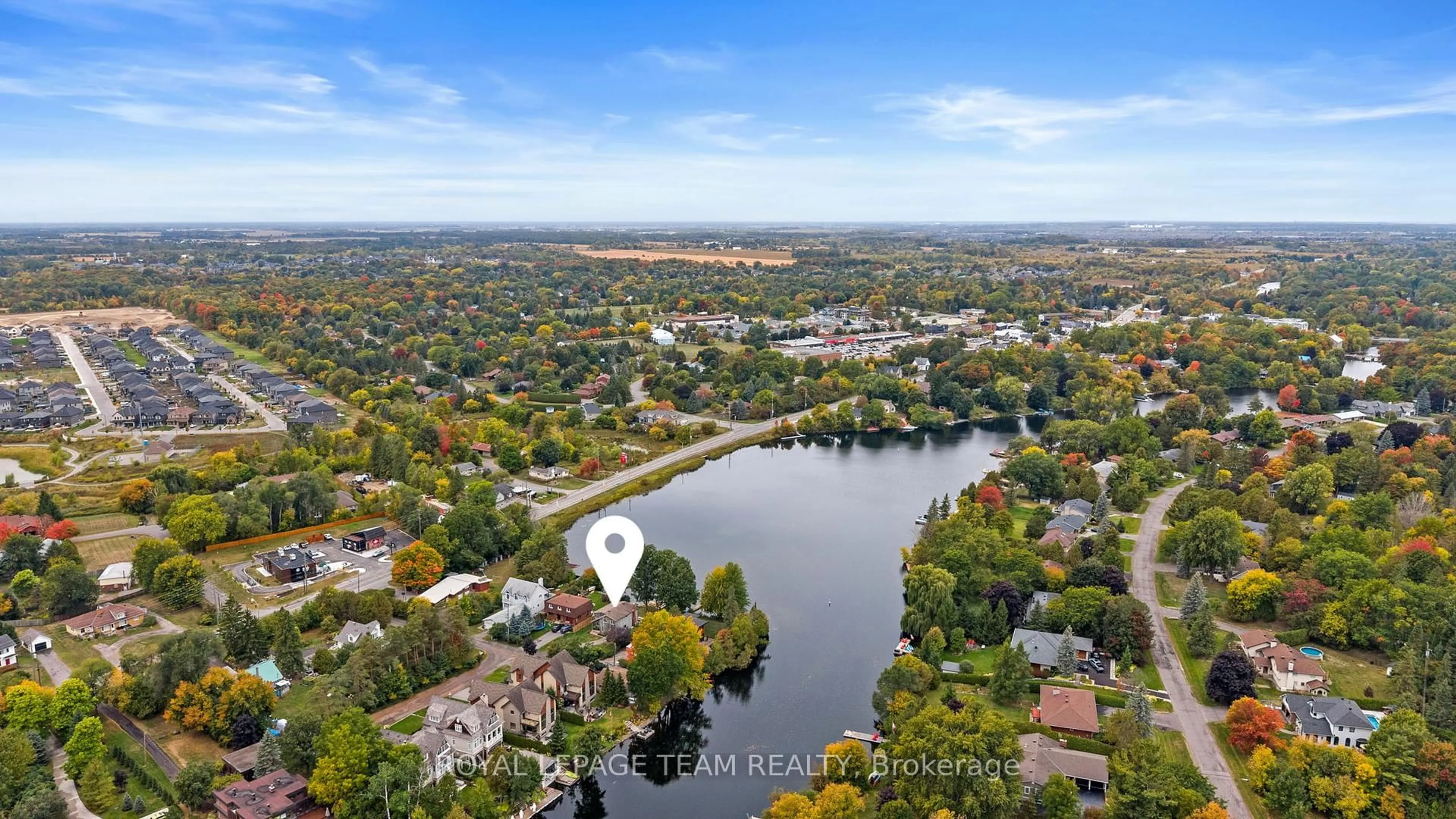 A pic from outside/outdoor area/front of a property/back of a property/a pic from drone, water/lake/river/ocean view for 1119 Firefly Lane, Manotick Ontario K4M 0T6