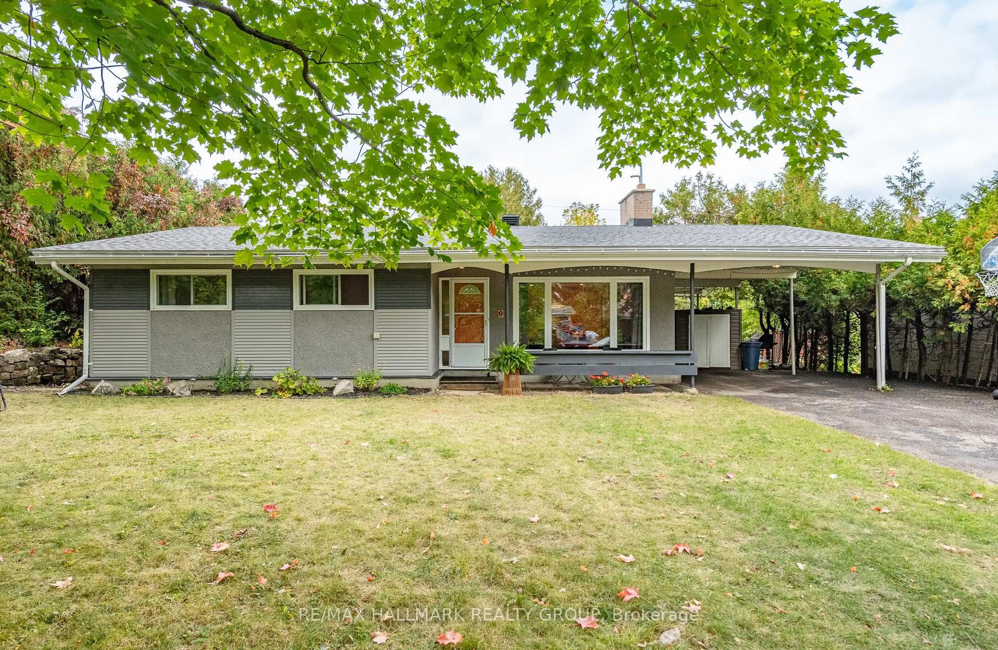 Home with vinyl exterior material, street for 9 Newbury Ave, Ottawa Ontario K2E 6K7