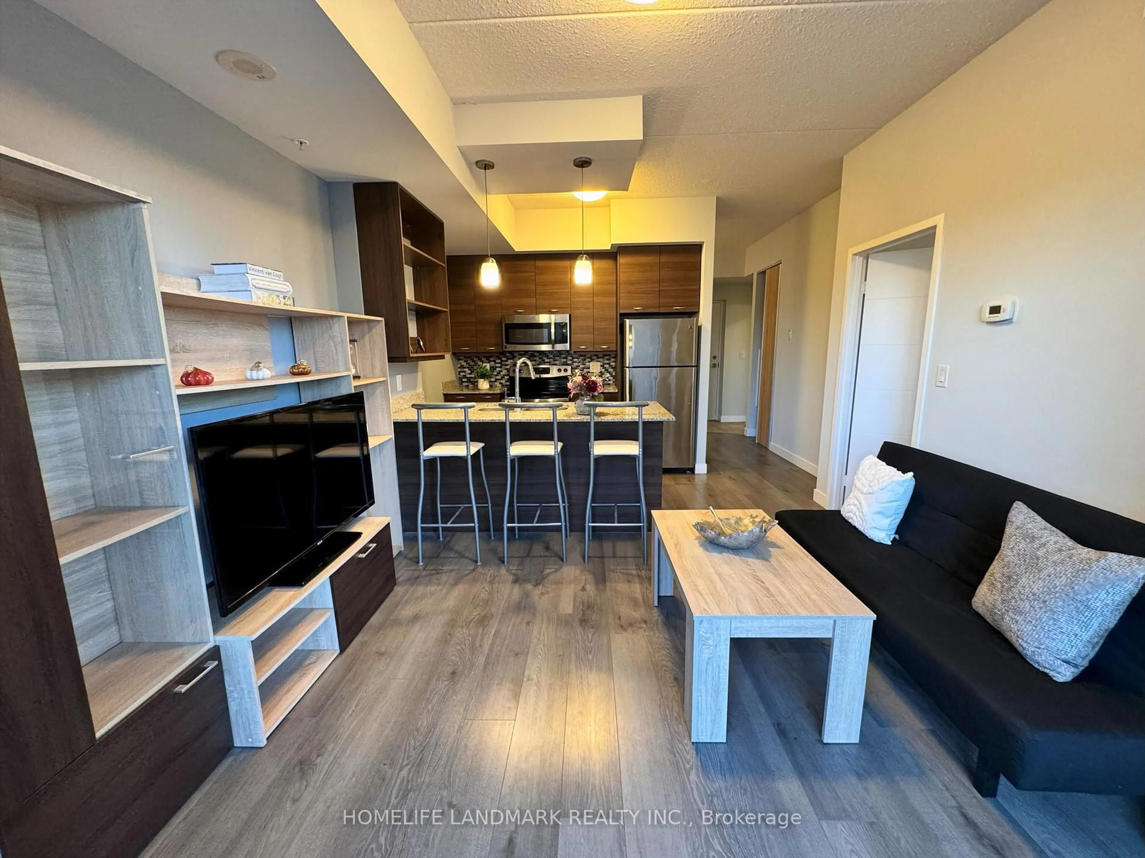 Open concept kitchen, wood/laminate floor for 318 Spruce St #801, Waterloo Ontario N2L 3M7