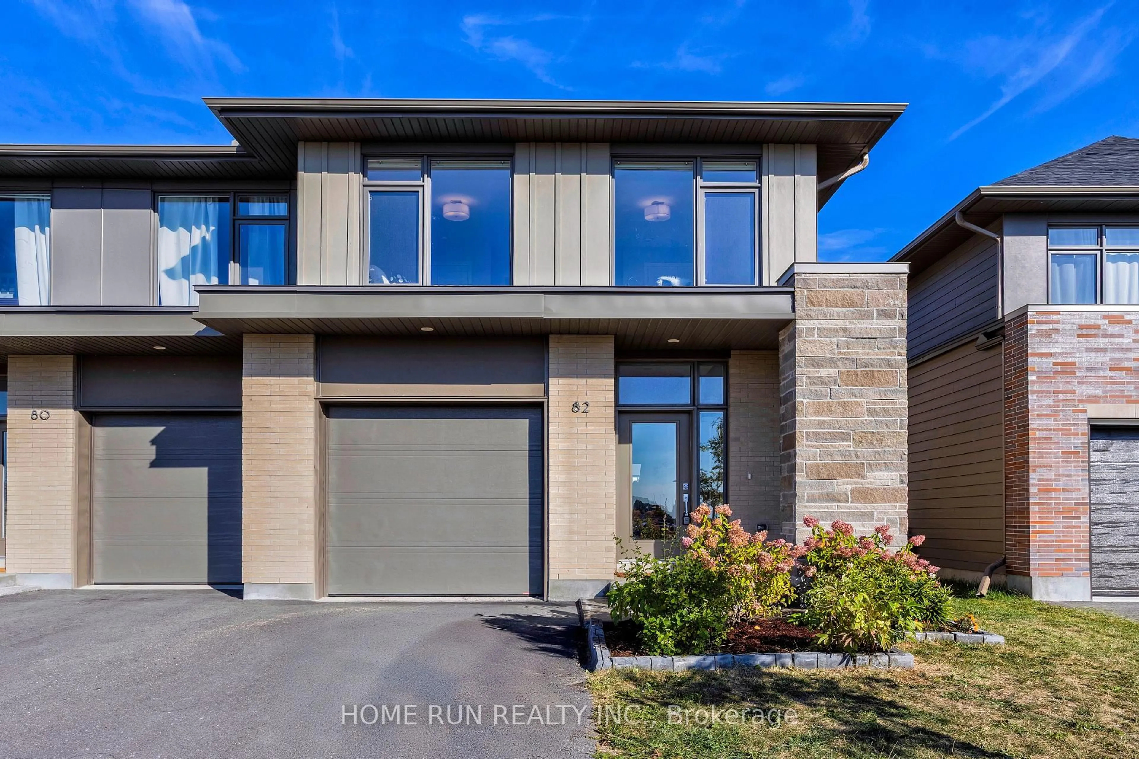 Home with brick exterior material, street for 82 Michael Stoqua St, Ottawa Ontario K1K 5A2