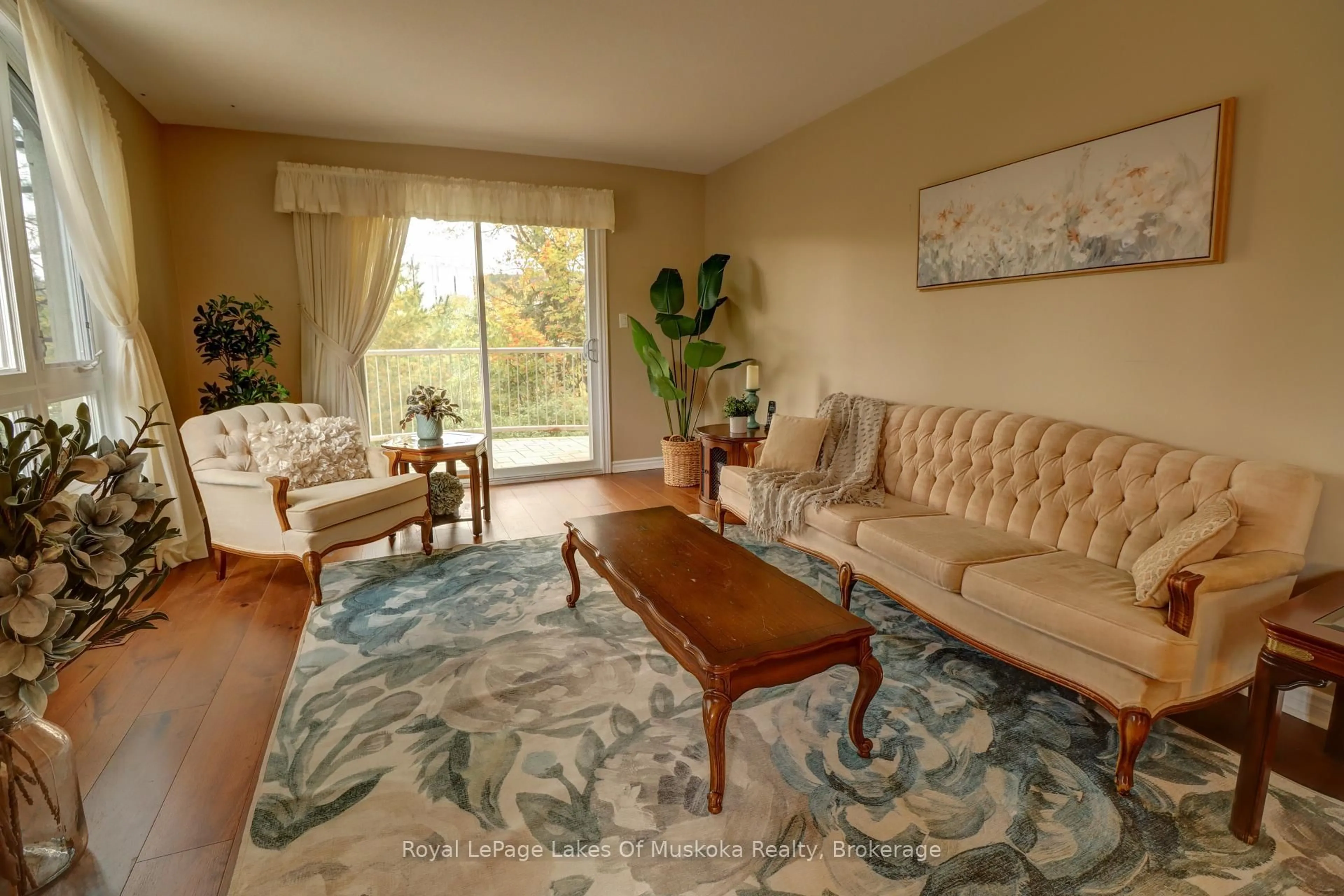 Living room with furniture, carpet floor for 31 Dairy Lane #106, Huntsville Ontario P1H 2L7