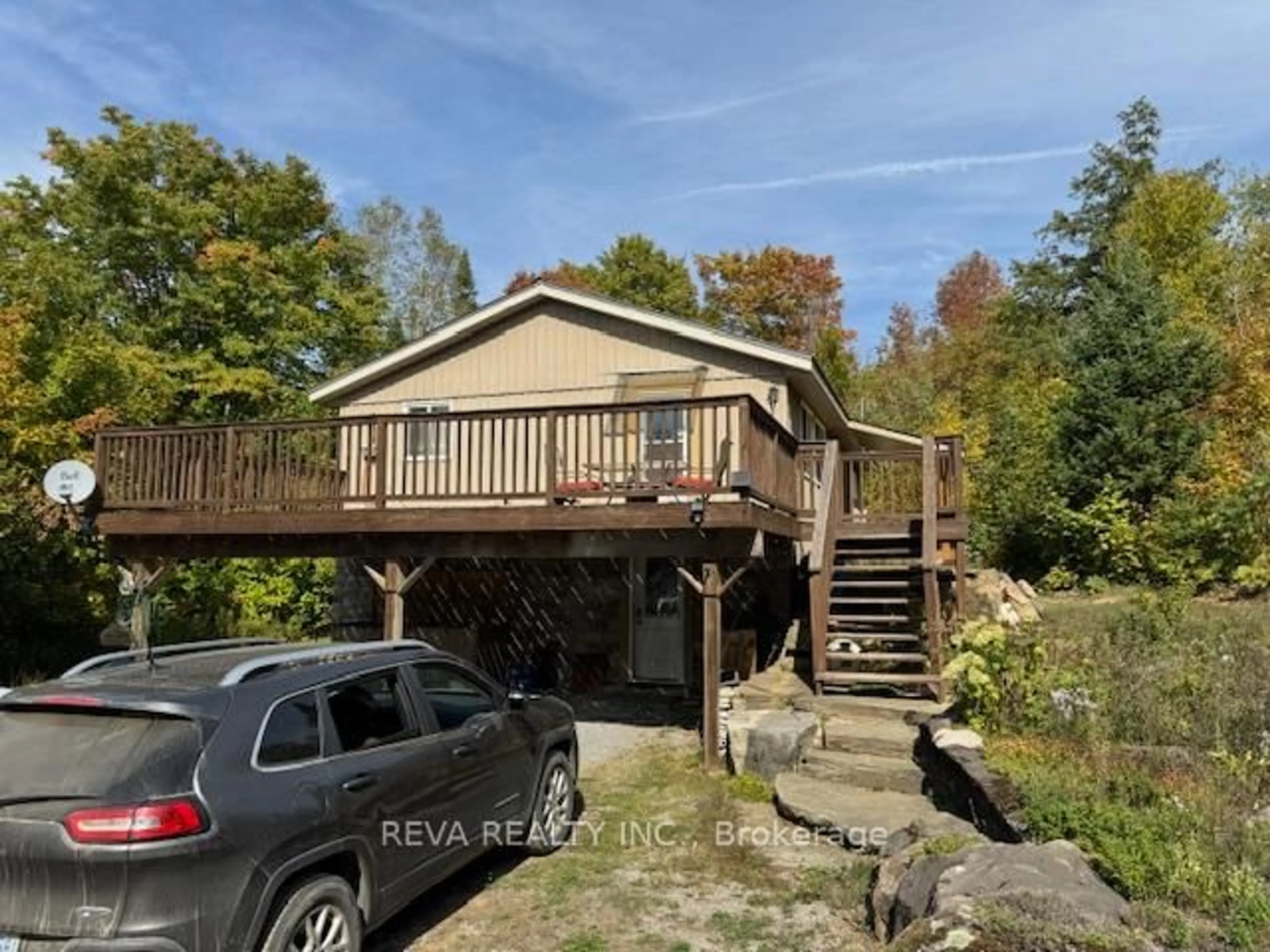 A pic from outside/outdoor area/front of a property/back of a property/a pic from drone, water/lake/river/ocean view for 472 Rose Island Rd, Coe Hill Ontario K0L 1P0