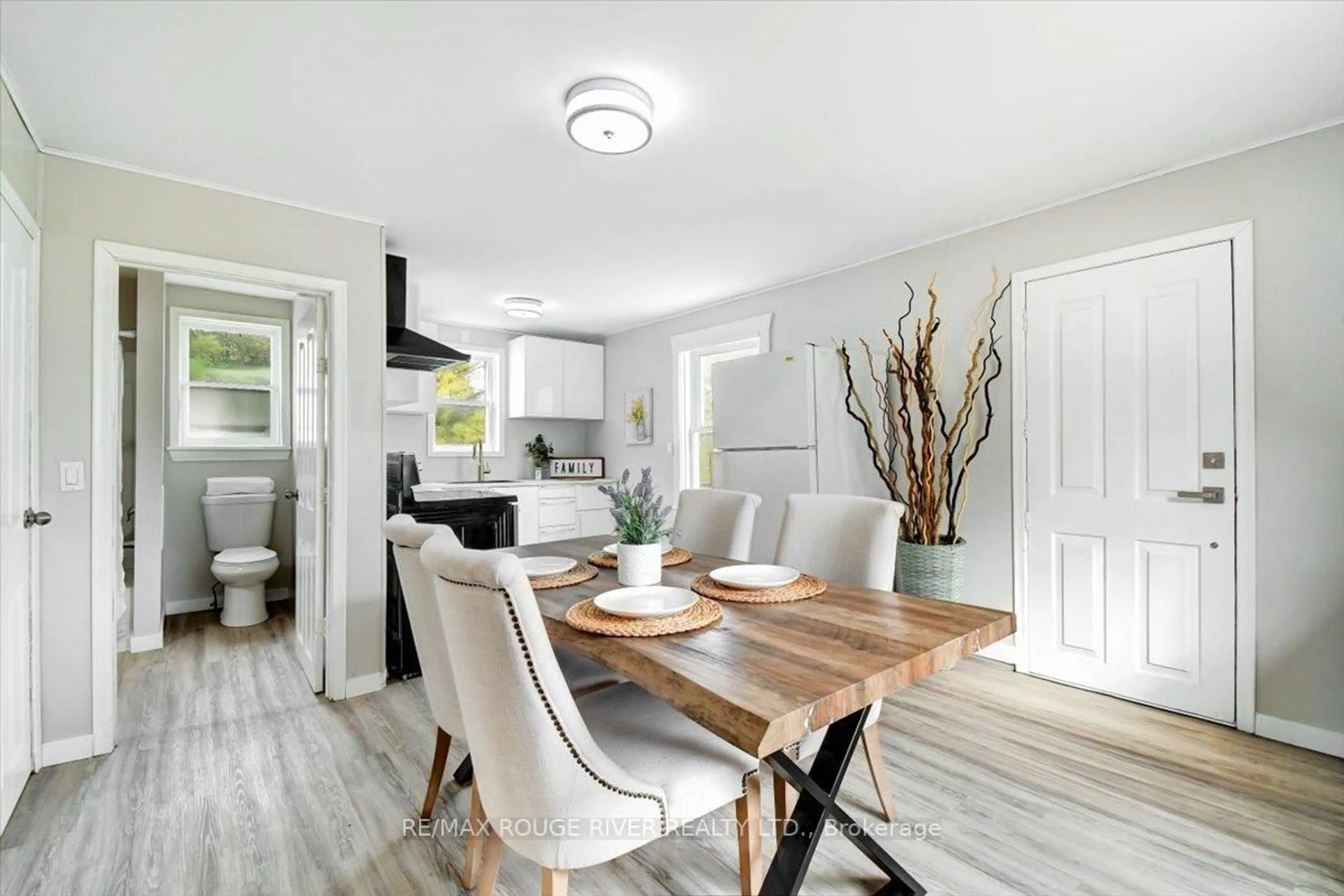 Open concept kitchen, wood/laminate floor for 232 Lyle St, Alnwick/Haldimand Ontario K0K 2G0