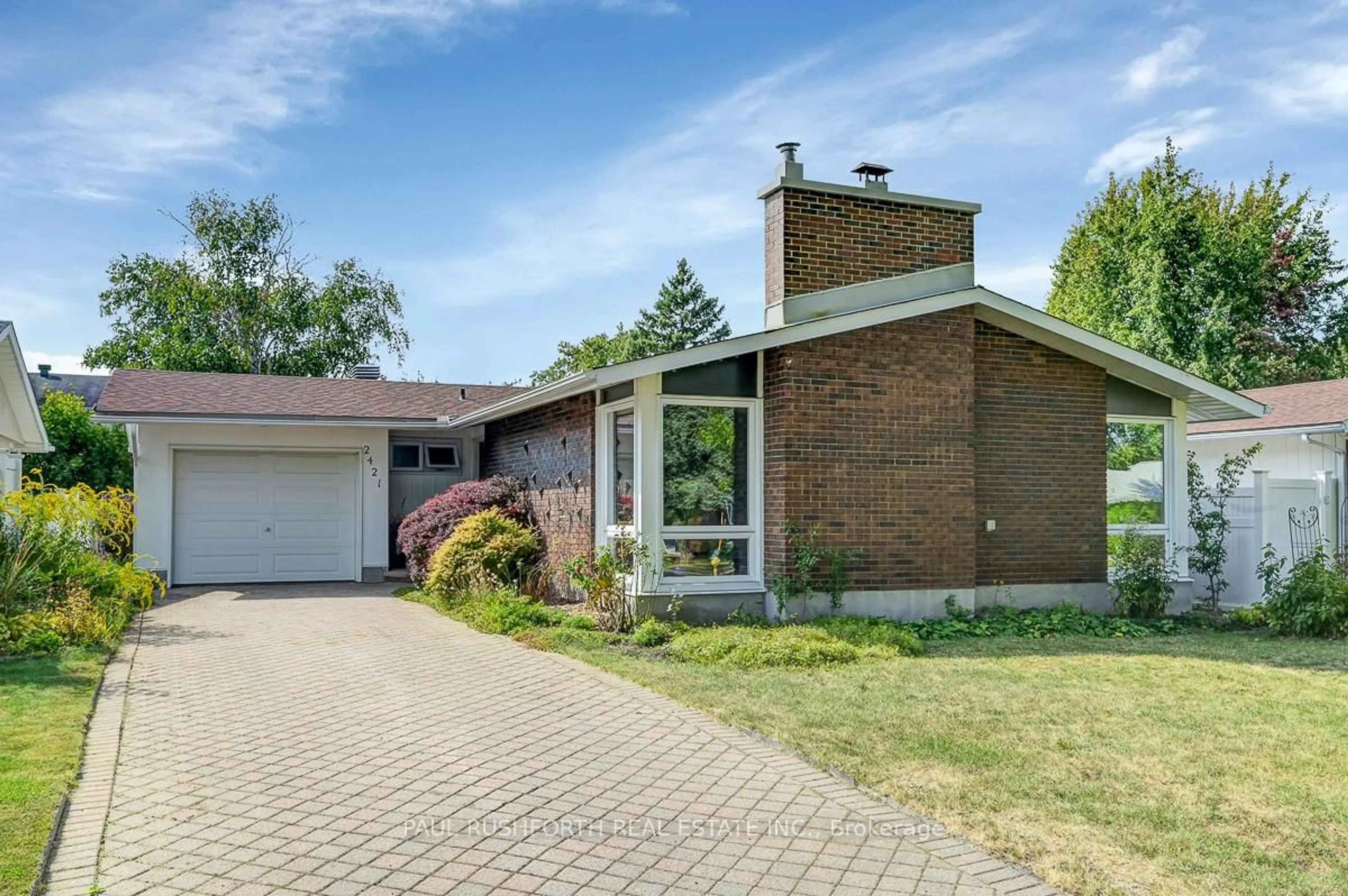 Home with brick exterior material, street for 2421 Ogilvie Rd, Ottawa Ontario K1J 7N3