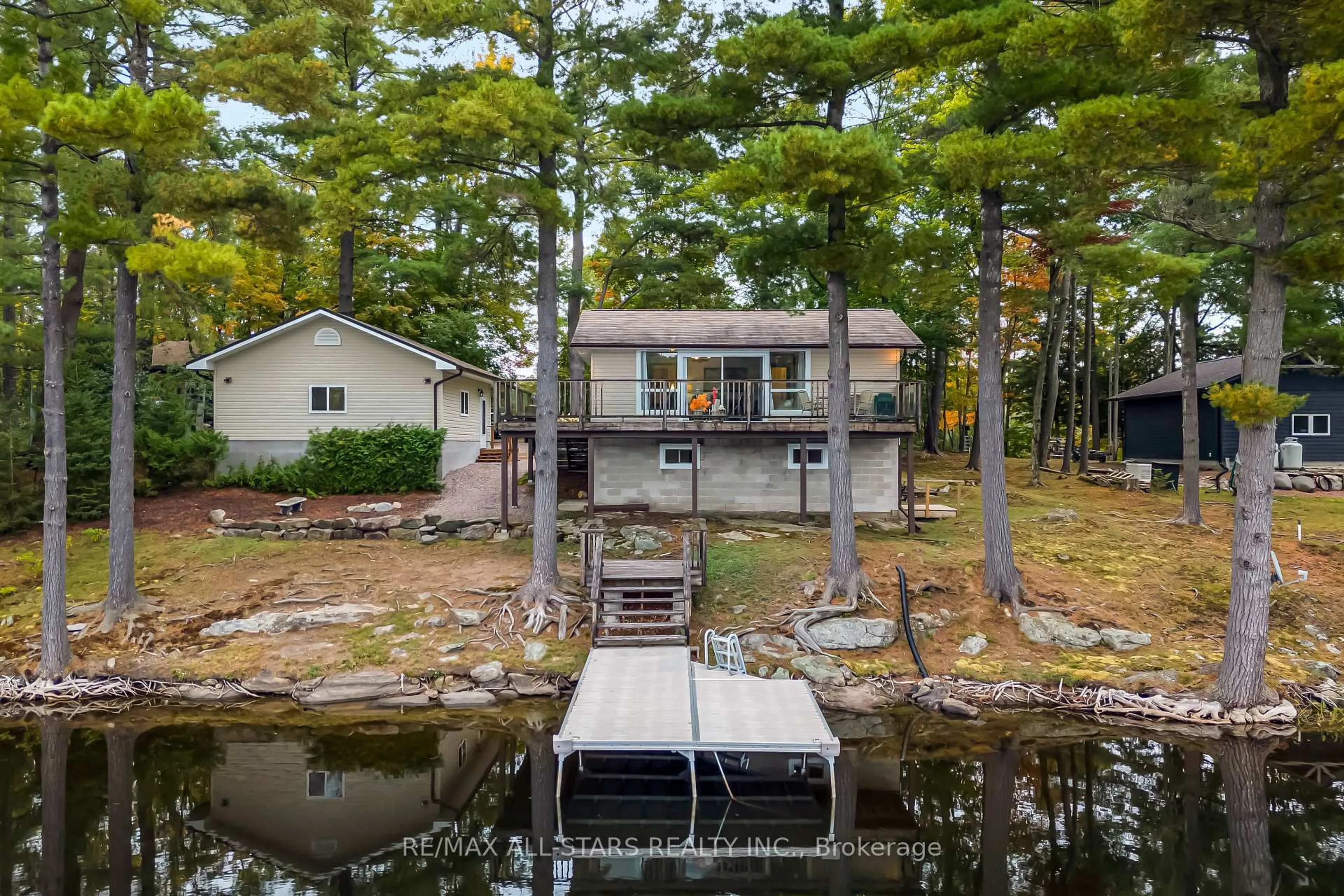 A pic from outside/outdoor area/front of a property/back of a property/a pic from drone, water/lake/river/ocean view for 1006 Youngs Rd #Cottage #9, Muskoka Lakes Ontario P0B 1J0