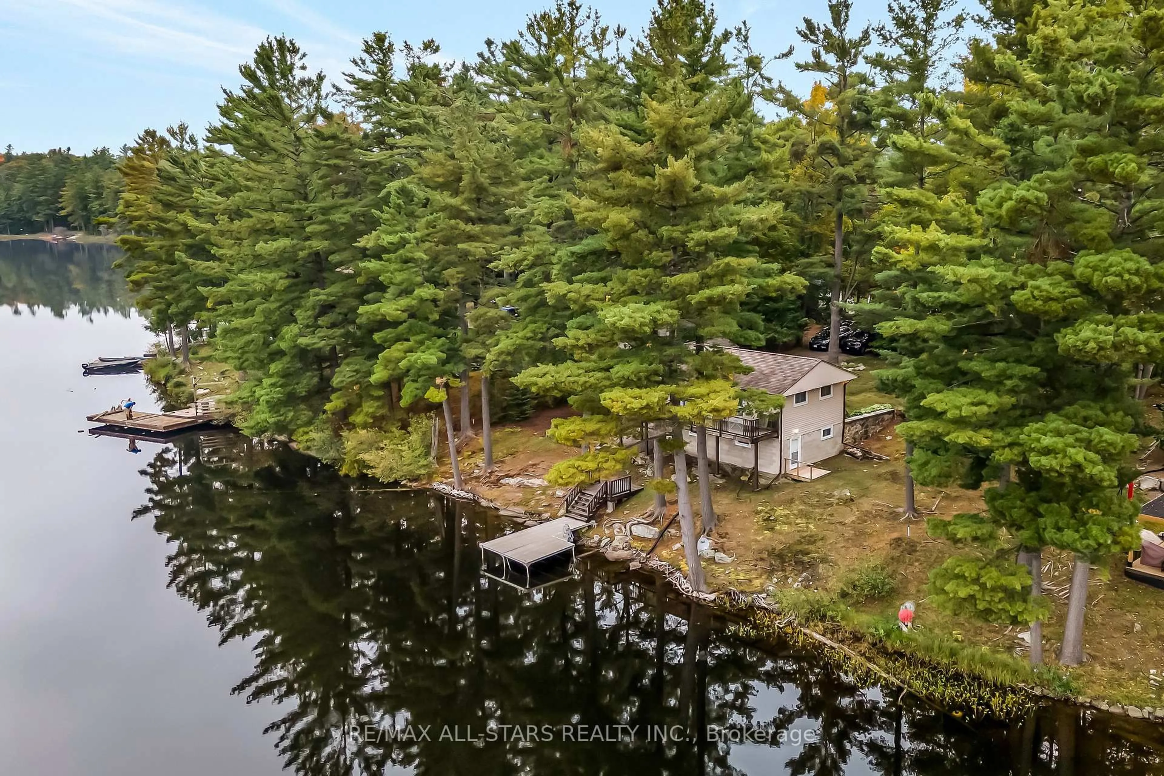 A pic from outside/outdoor area/front of a property/back of a property/a pic from drone, water/lake/river/ocean view for 1006 Youngs Rd #Cottage #9, Muskoka Lakes Ontario P0B 1J0