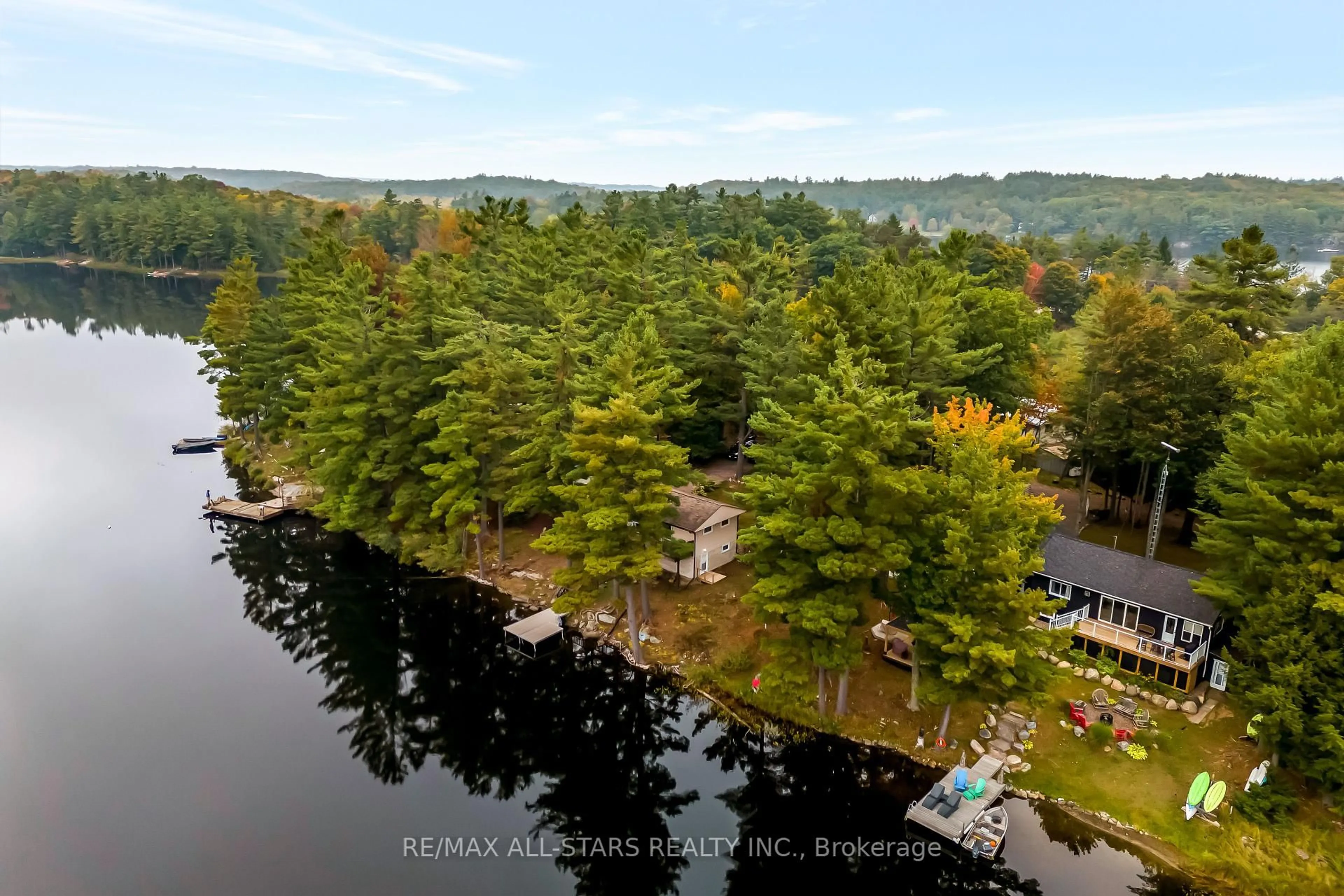 A pic from outside/outdoor area/front of a property/back of a property/a pic from drone, water/lake/river/ocean view for 1006 Youngs Rd #Cottage #9, Muskoka Lakes Ontario P0B 1J0