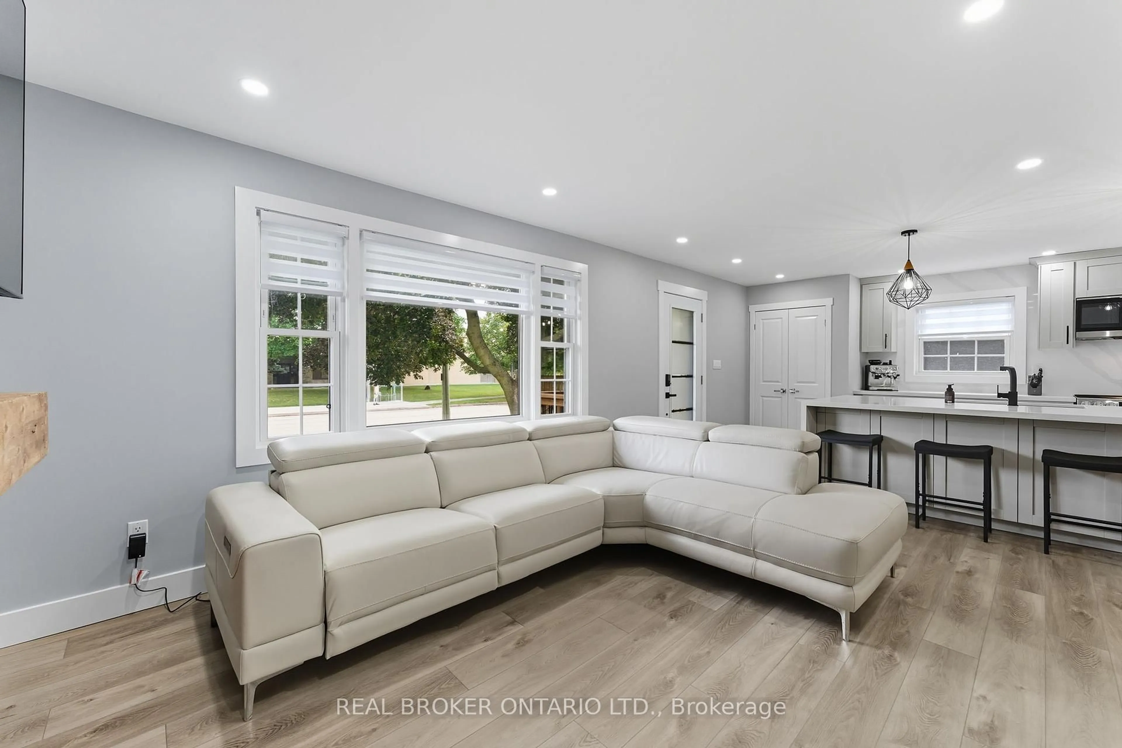 Living room with furniture, ceramic/tile floor for 61 Clench Ave, Brantford Ontario N3T 1B7