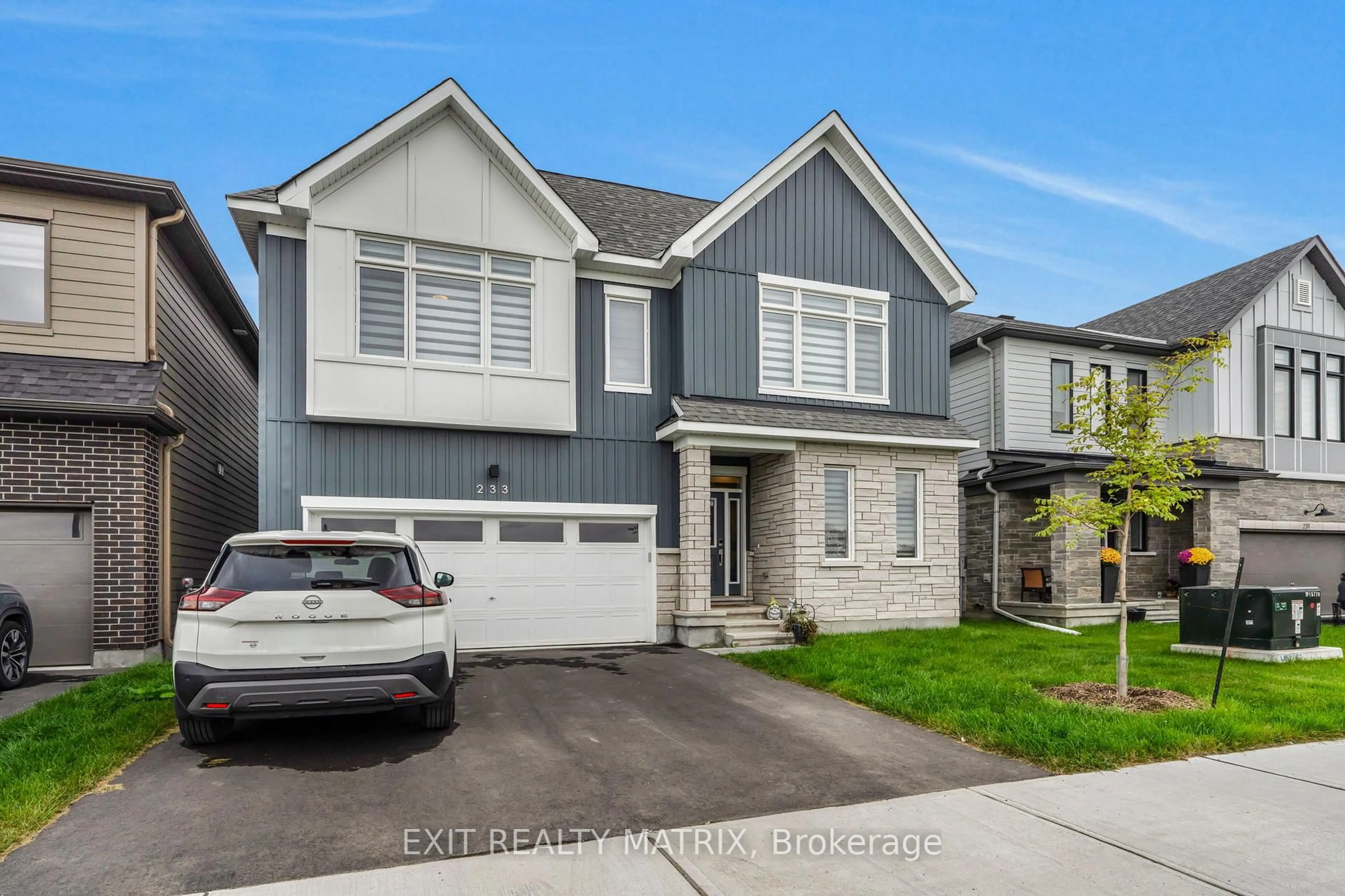 Home with vinyl exterior material, street for 233 Conservancy Dr, Ottawa Ontario K2J 7M5