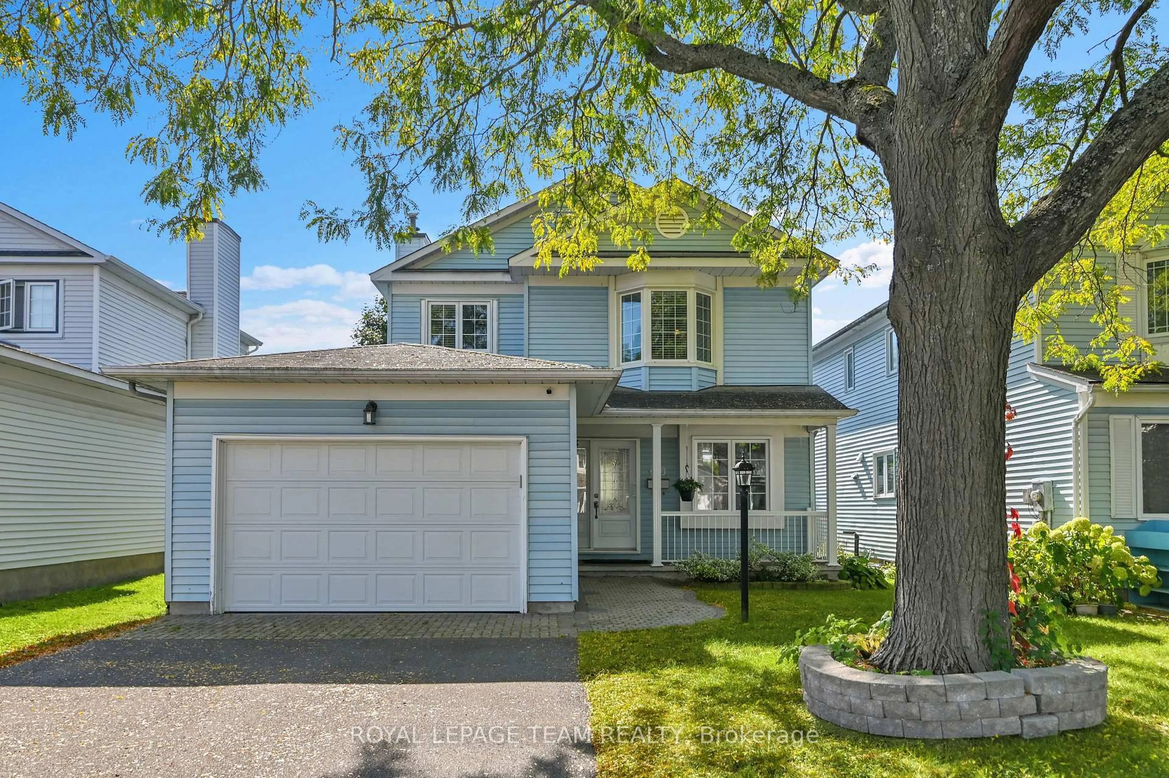 Home with vinyl exterior material, street for 310 McEachern Cres, Orleans Ontario K1E 3K2