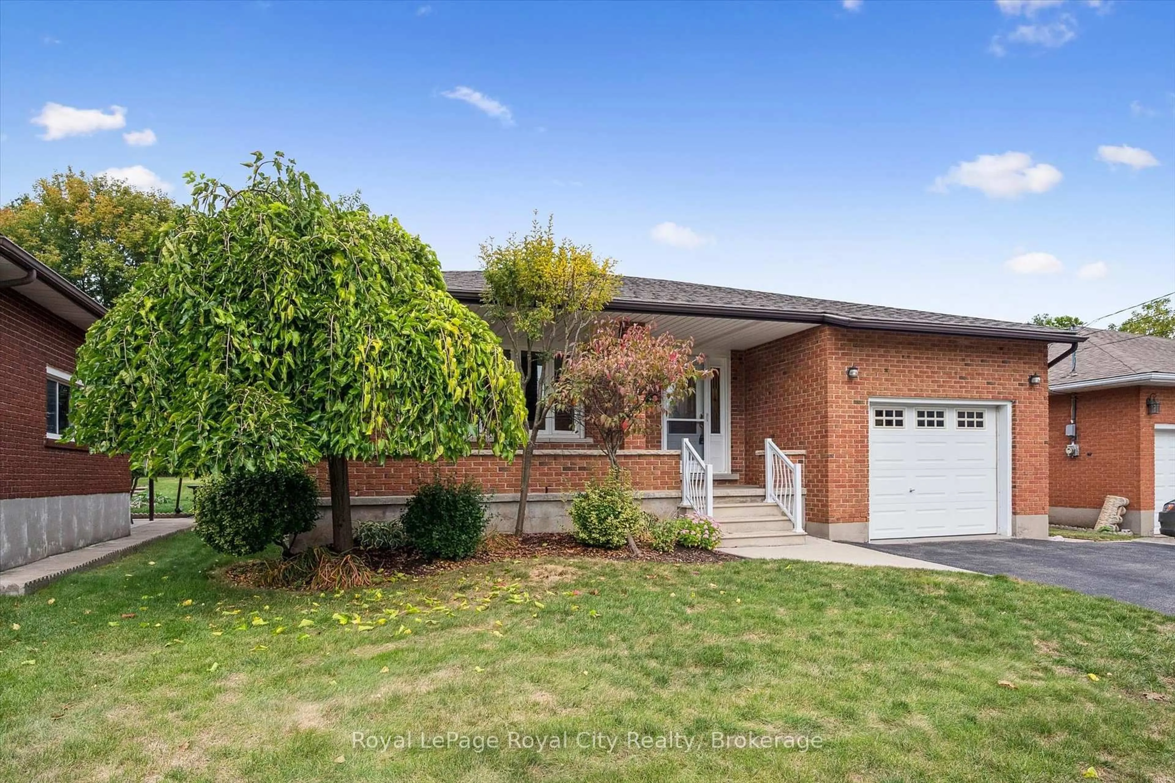 Home with brick exterior material, street for 21 Heath Rd, Guelph Ontario N1H 6G8