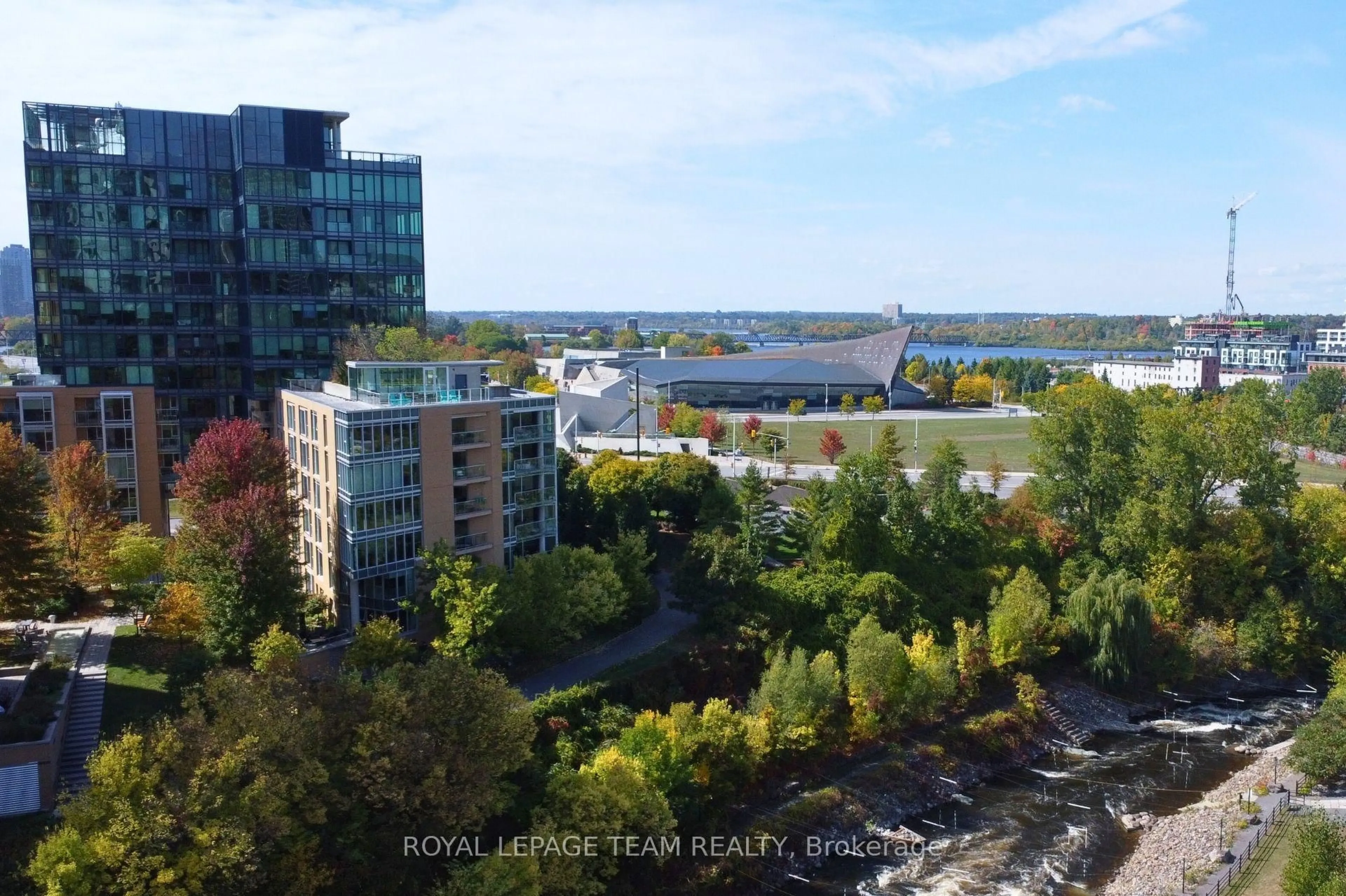 A pic from outside/outdoor area/front of a property/back of a property/a pic from drone, water/lake/river/ocean view for 200 Lett St #406, Ottawa Ontario K1R 0A7