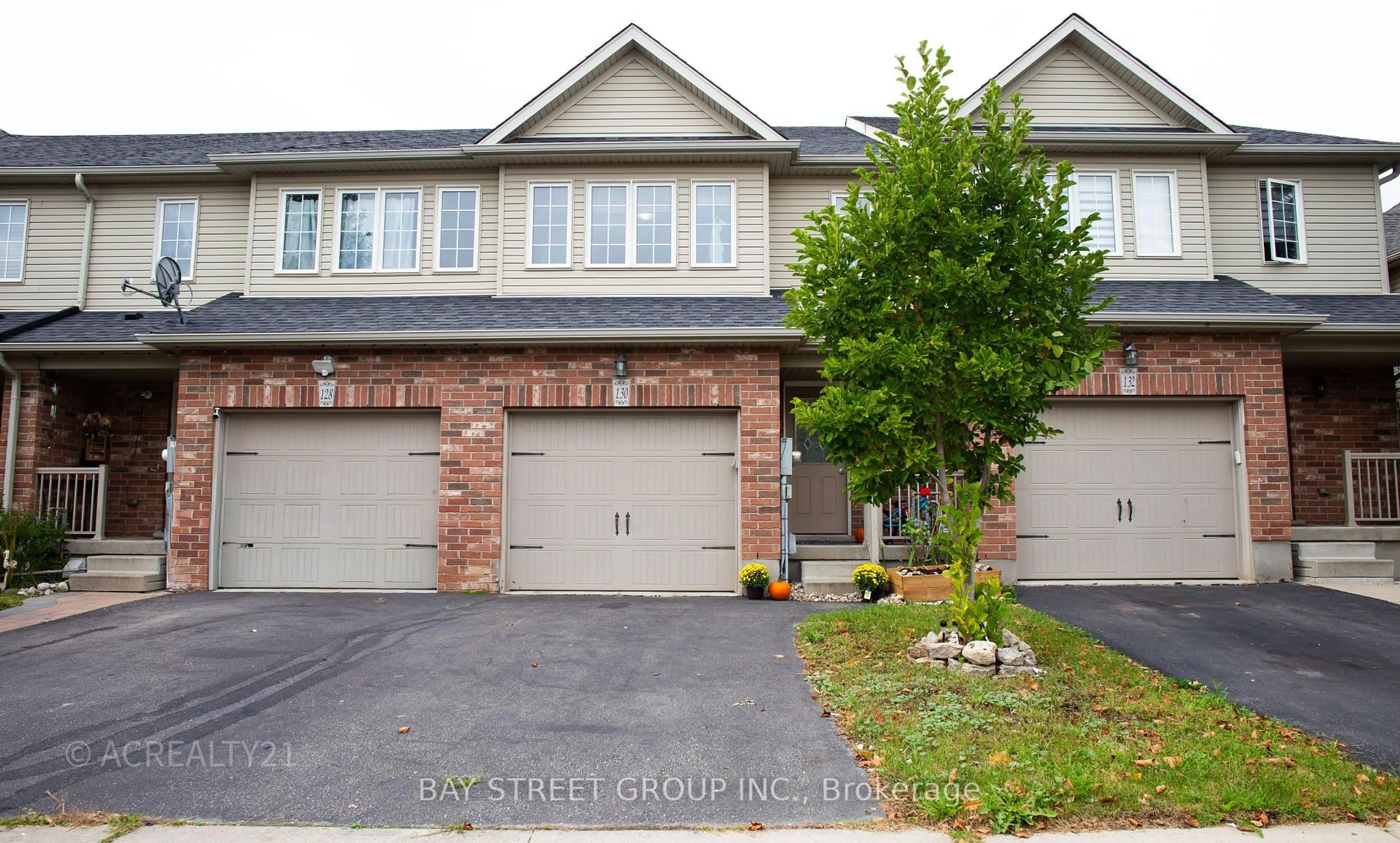 Home with brick exterior material, street for 130 Simmonds Dr, Guelph Ontario N1E 7L8