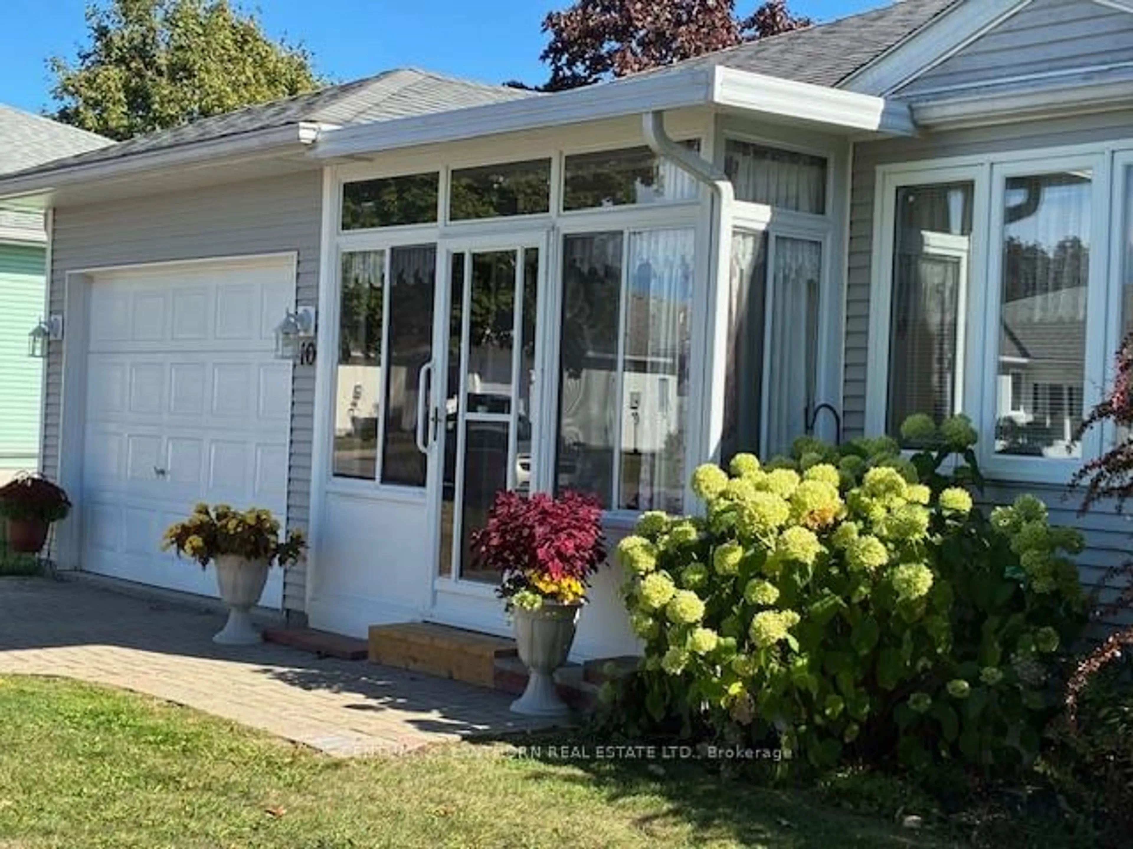 Home with vinyl exterior material, street for 10 Reynolds Pl, Prince Edward County Ontario K0K 3L0