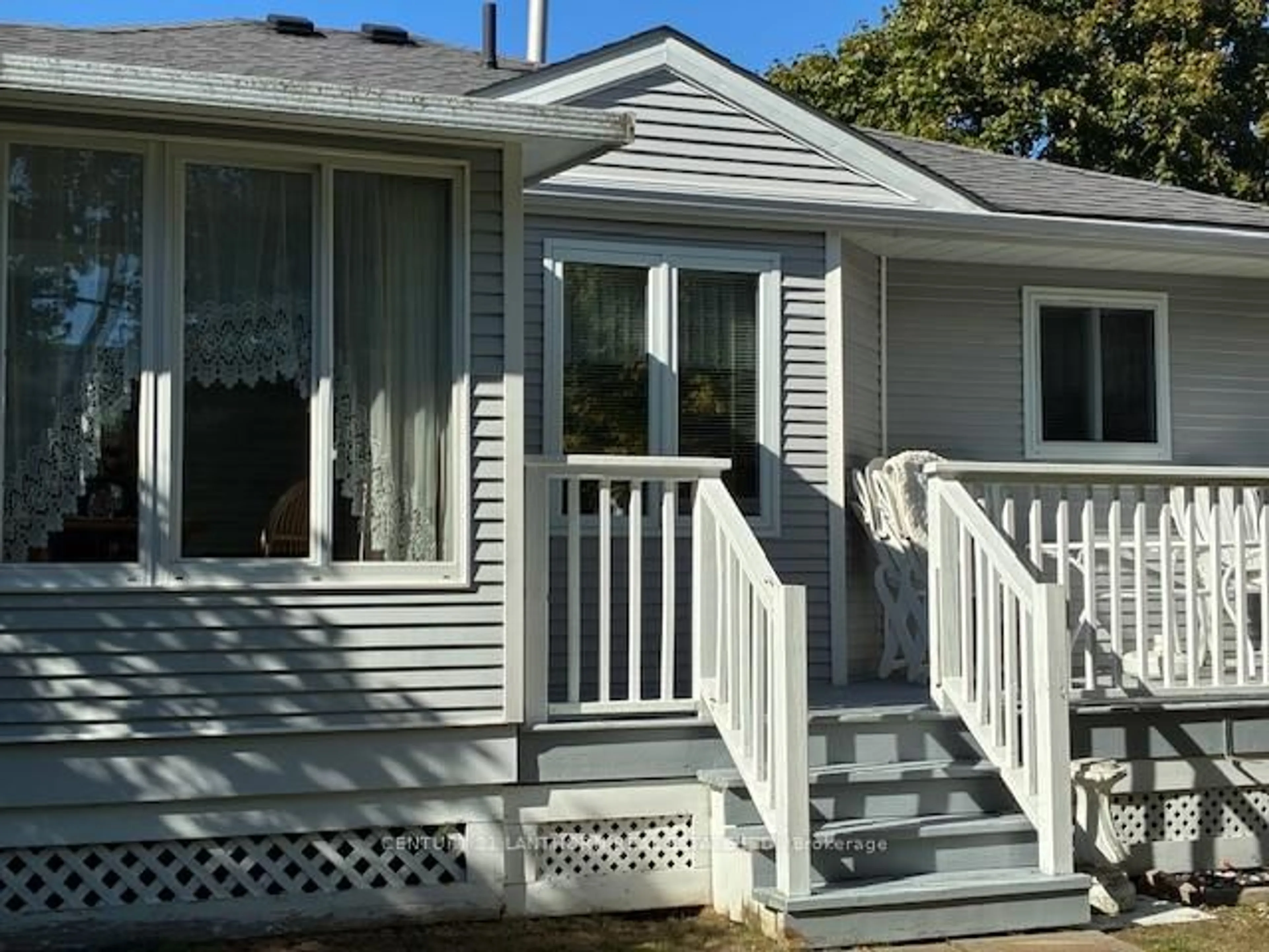 Home with vinyl exterior material, street for 10 Reynolds Pl, Prince Edward County Ontario K0K 3L0