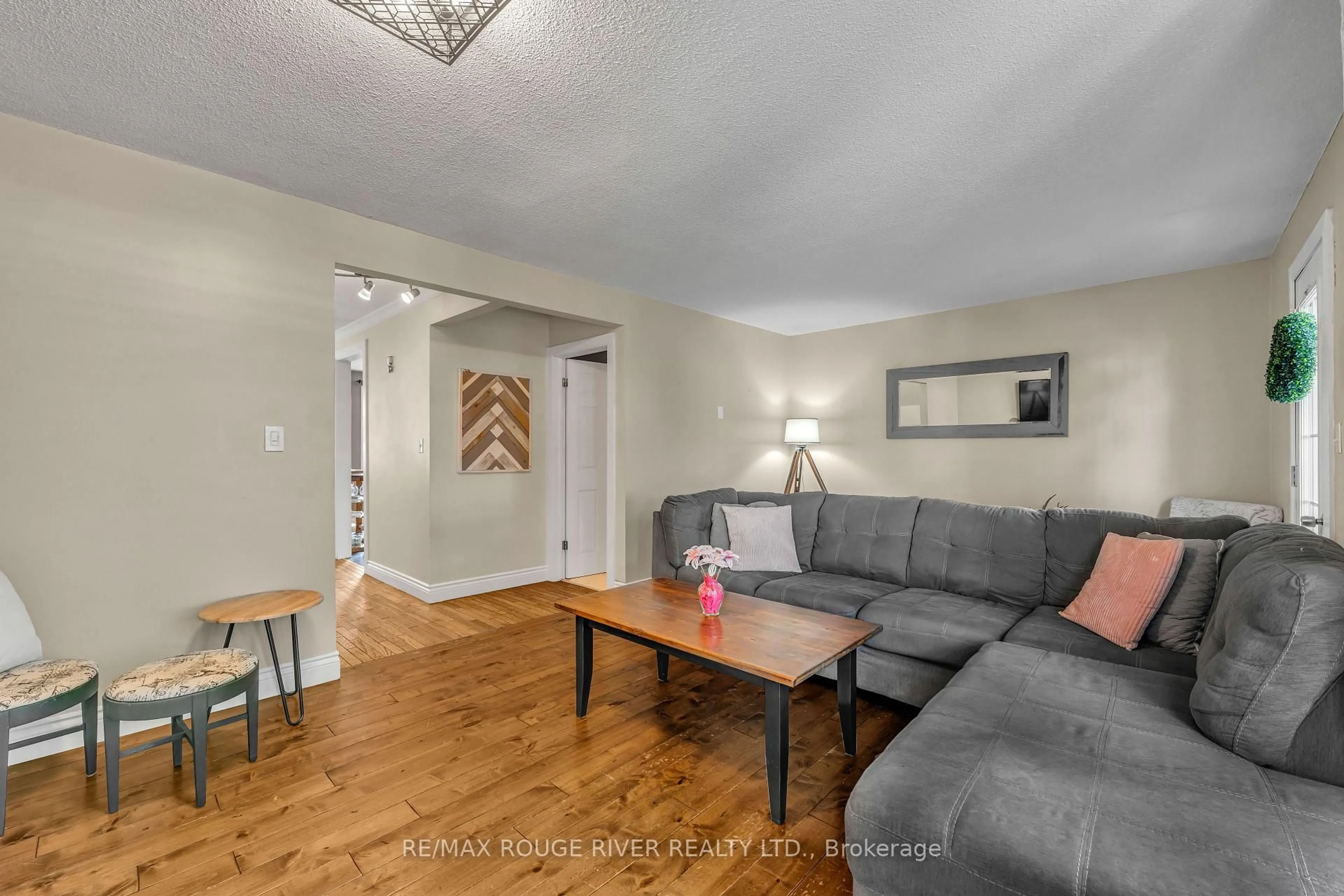 Living room with furniture, wood/laminate floor for 59 Peacock Blvd, Port Hope Ontario L1A 2X2