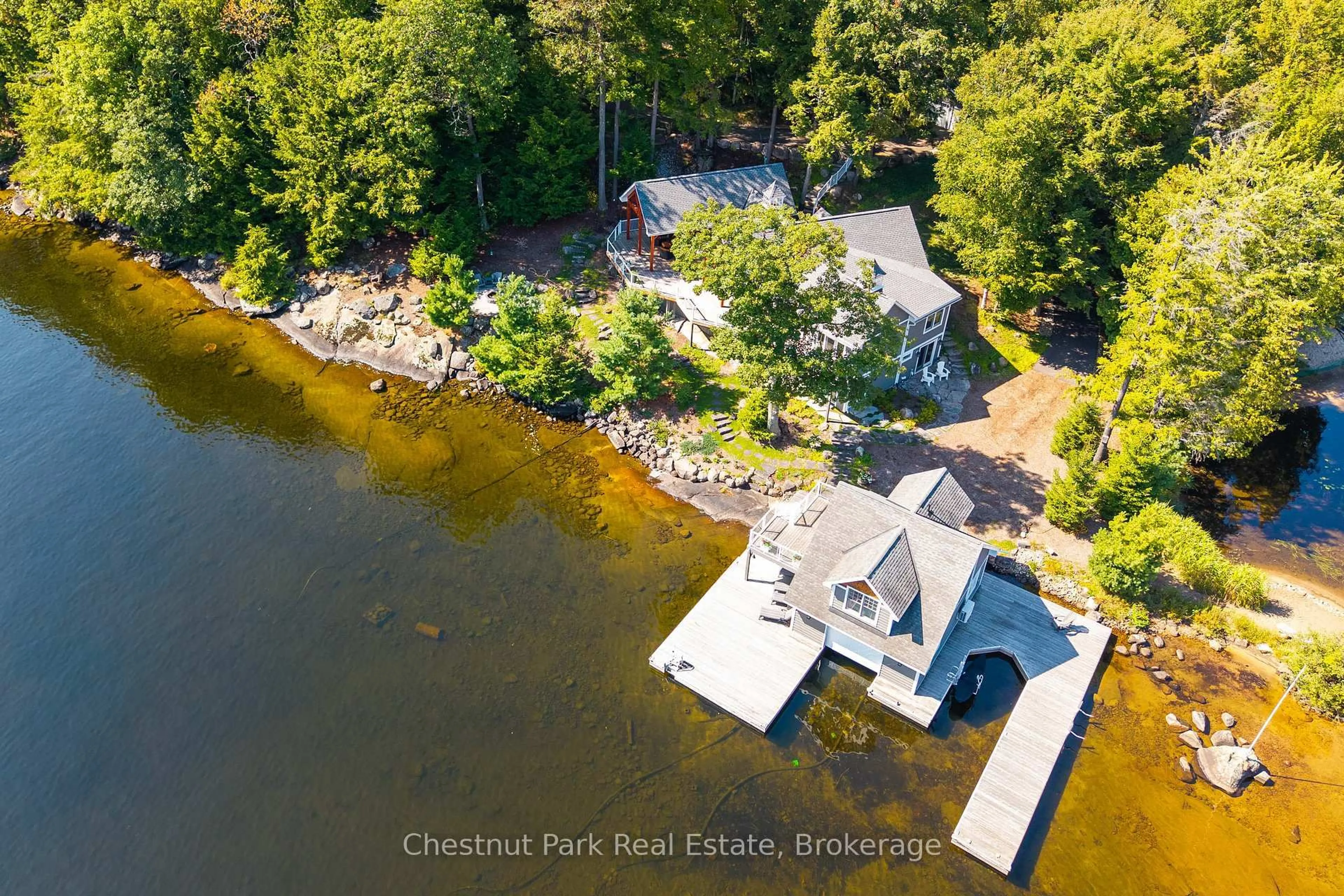 A pic from outside/outdoor area/front of a property/back of a property/a pic from drone, water/lake/river/ocean view for 1092 Scarcliffe Rd #7, Muskoka Lakes Ontario P0B 1J0