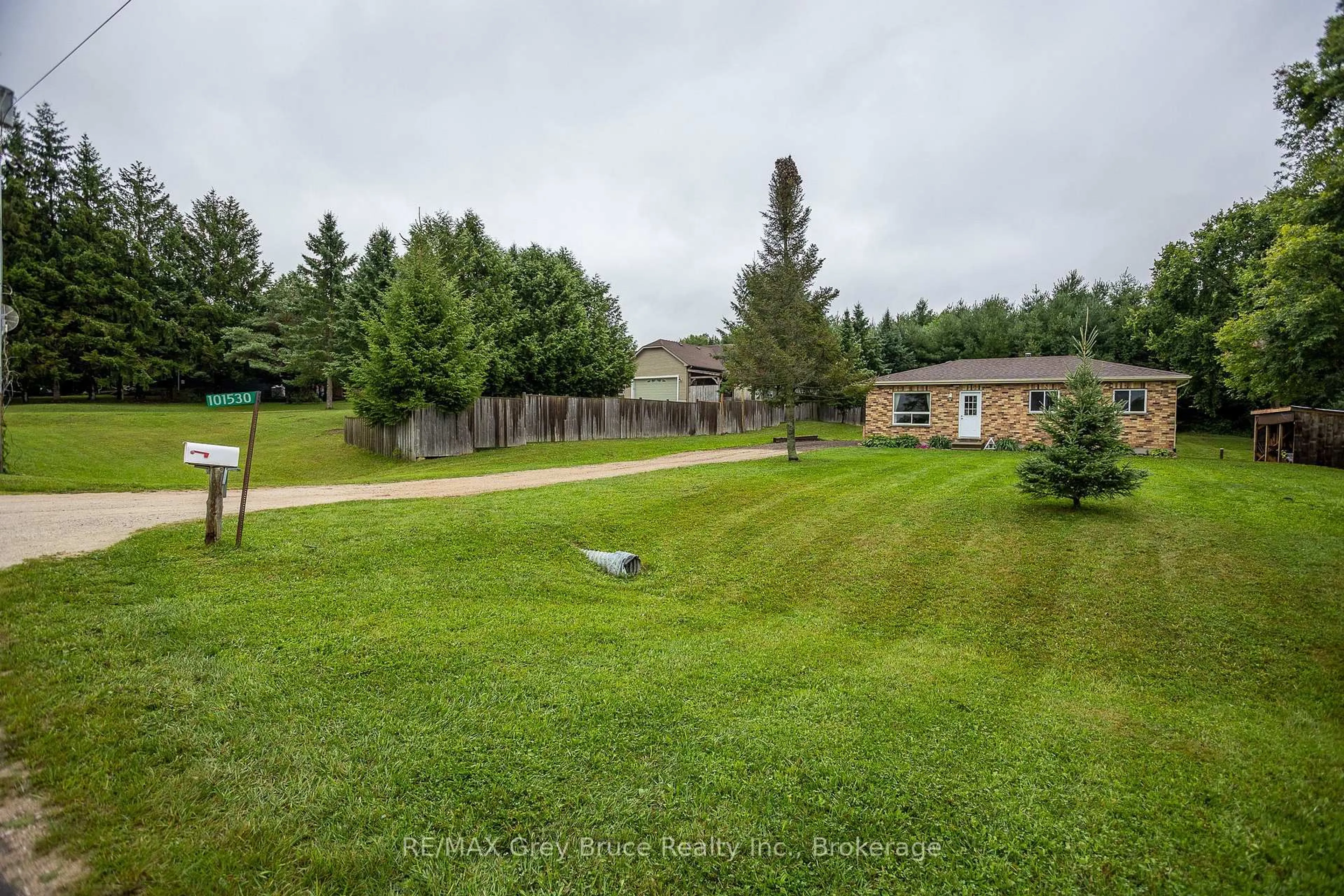 A pic from outside/outdoor area/front of a property/back of a property/a pic from drone, forest/trees view for 101530 Side Road 9, Georgian Bluffs Ontario N0H 2N0