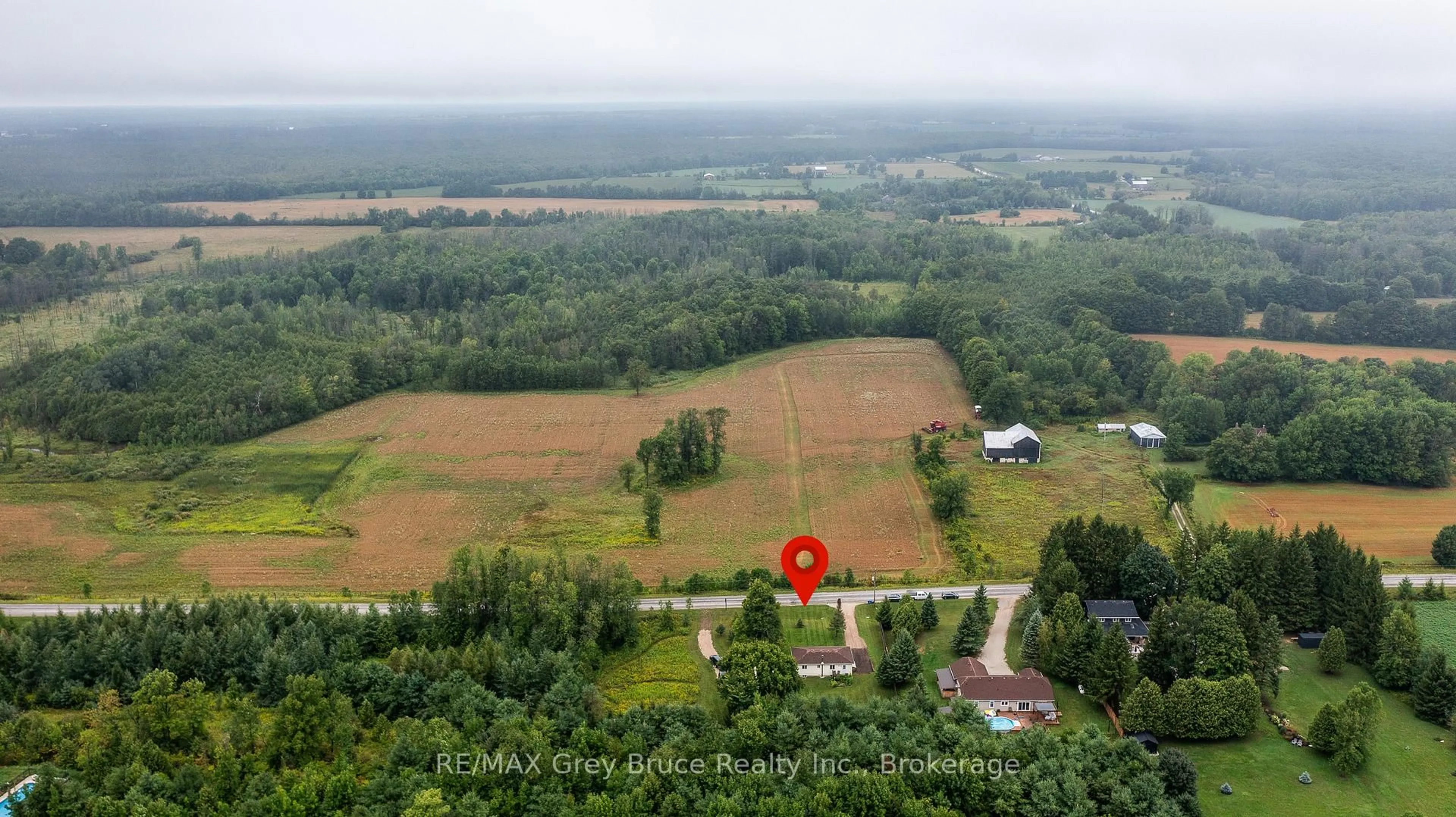 A pic from outside/outdoor area/front of a property/back of a property/a pic from drone, forest/trees view for 101530 Side Road 9, Georgian Bluffs Ontario N0H 2N0