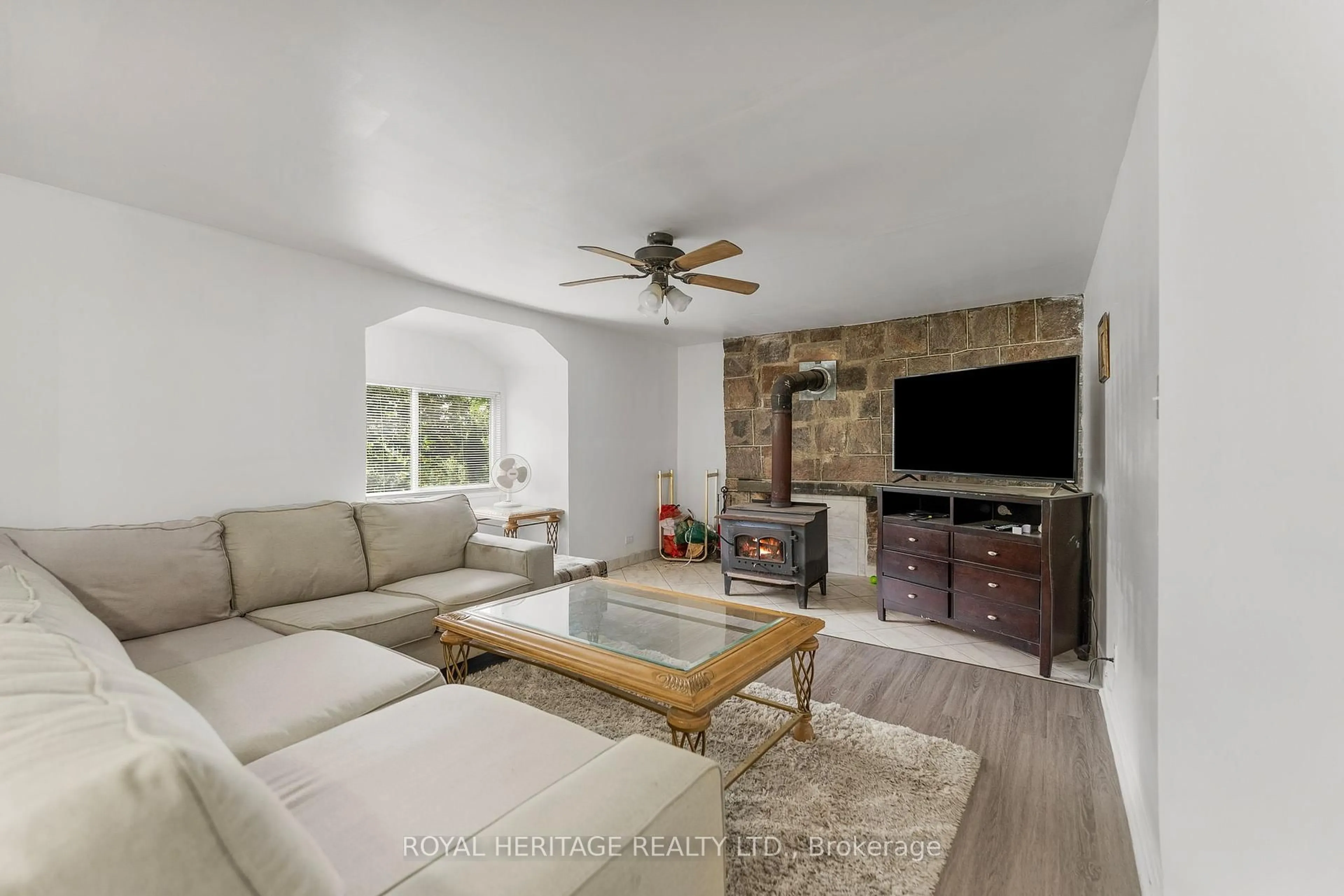 Living room with furniture, ceramic/tile floor for 17415 35 Highway, Algonquin Highlands Ontario K0M 2K0