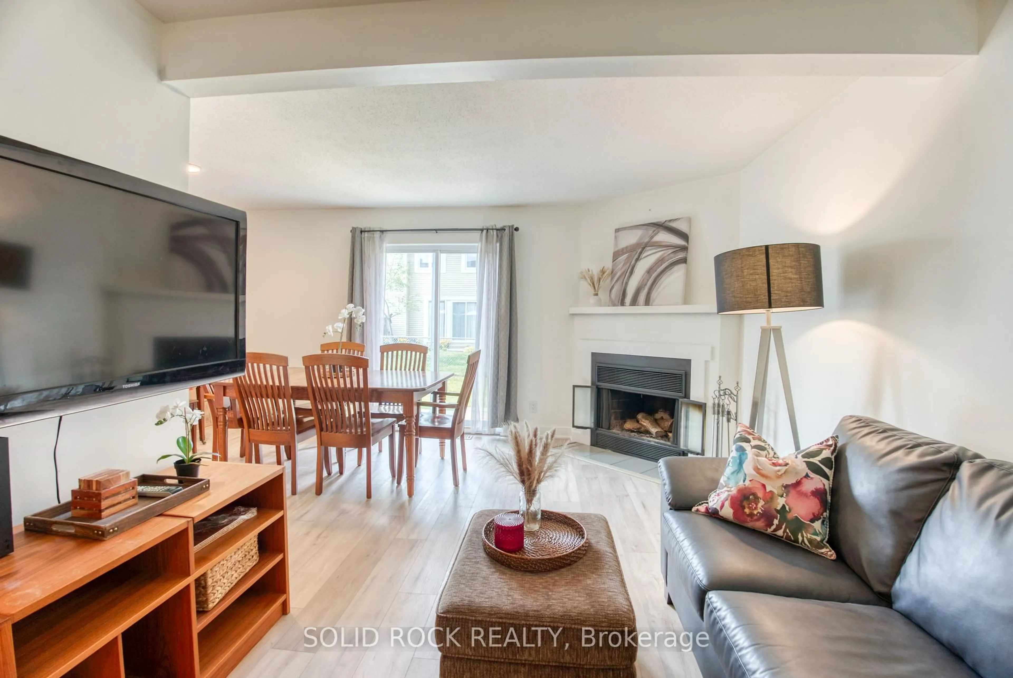 Living room with furniture, wood/laminate floor for 463 Canotia Pl #12, Ottawa Ontario K4A 2K2