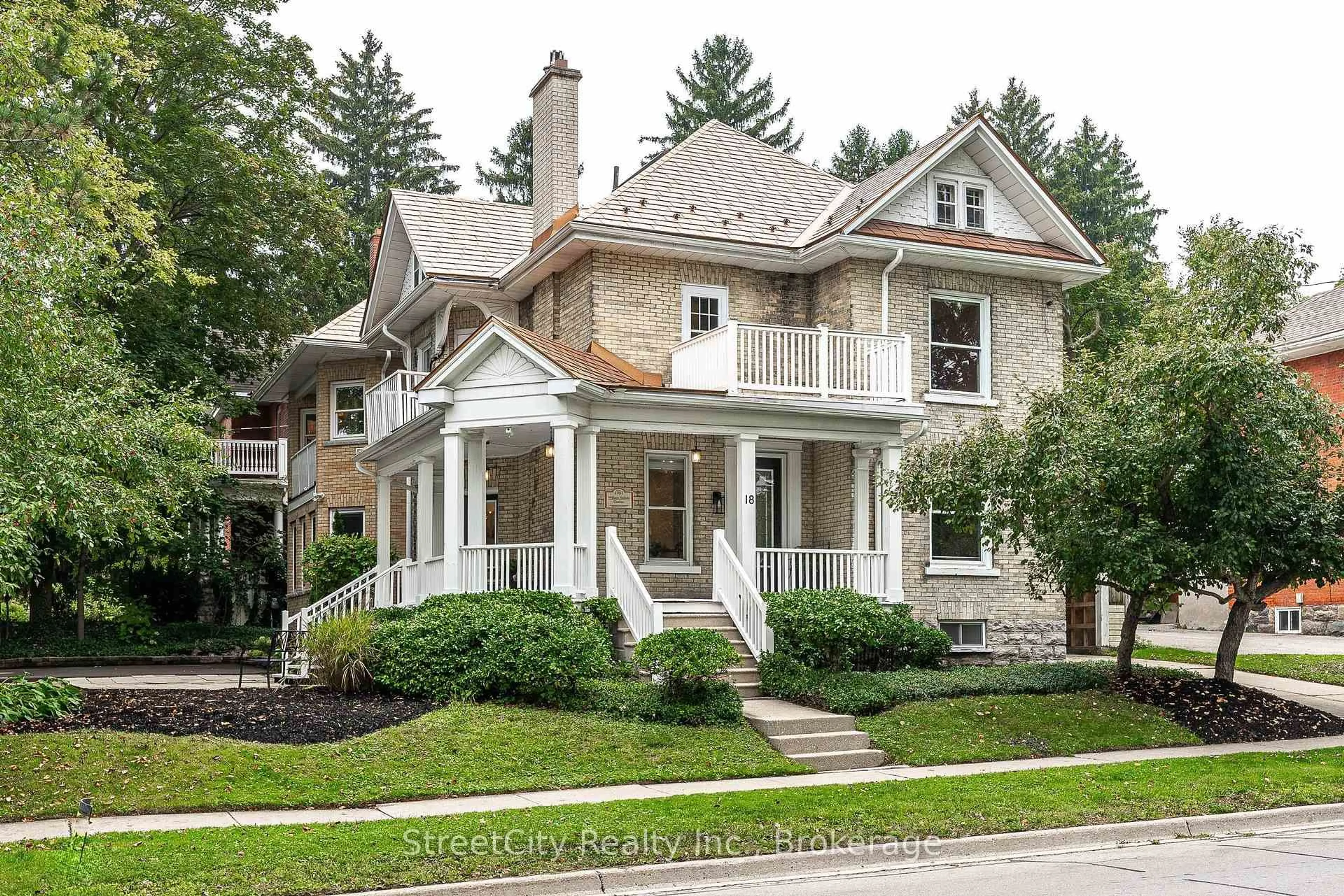 Home with brick exterior material, street for 18 Waterloo St, Stratford Ontario N5A 5H5