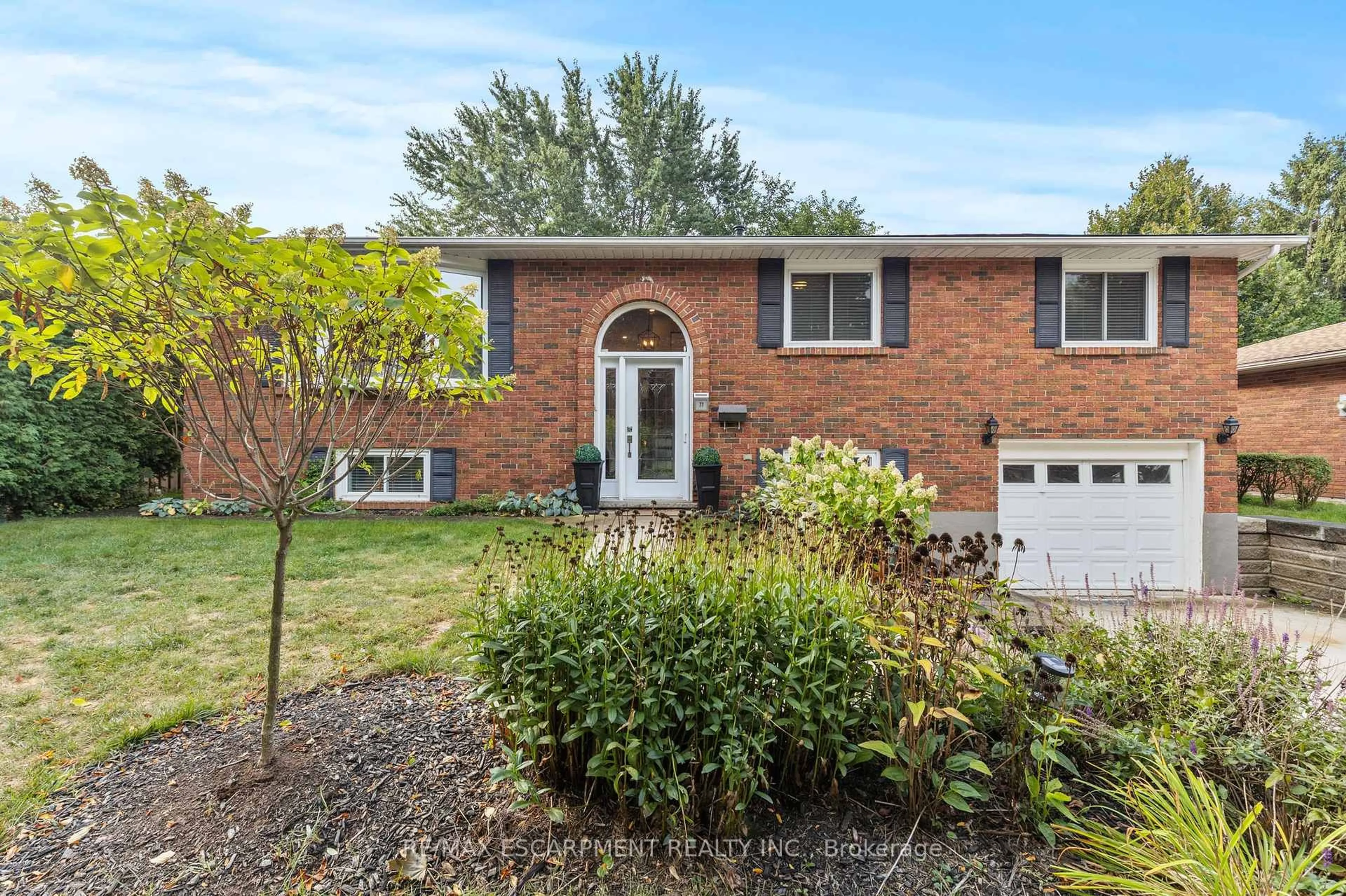 Home with brick exterior material, street for 77 Debora Dr, Grimsby Ontario L3M 4L3