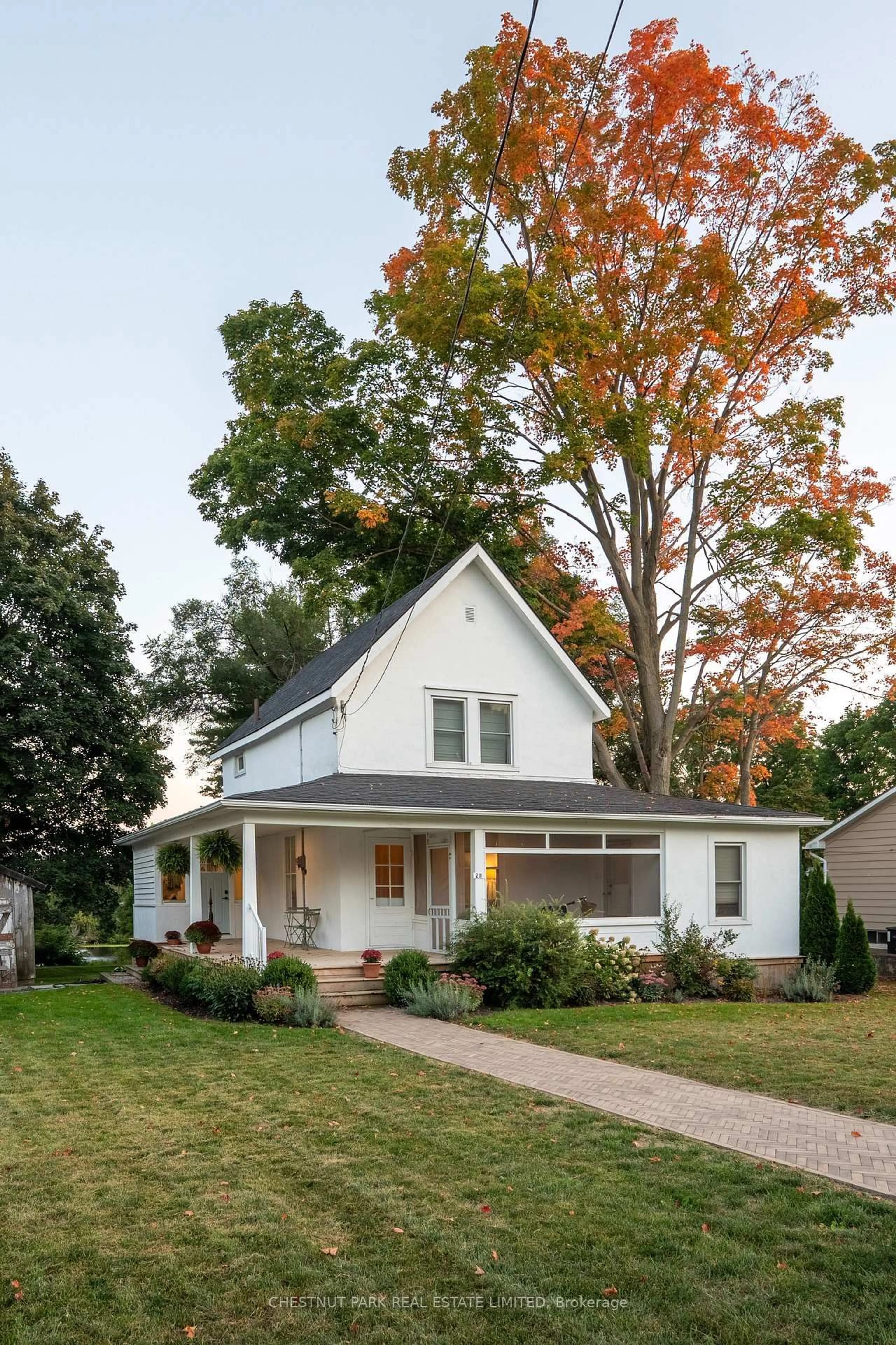 Home with vinyl exterior material, street for 211 Main St, Prince Edward County Ontario K0K 1G0