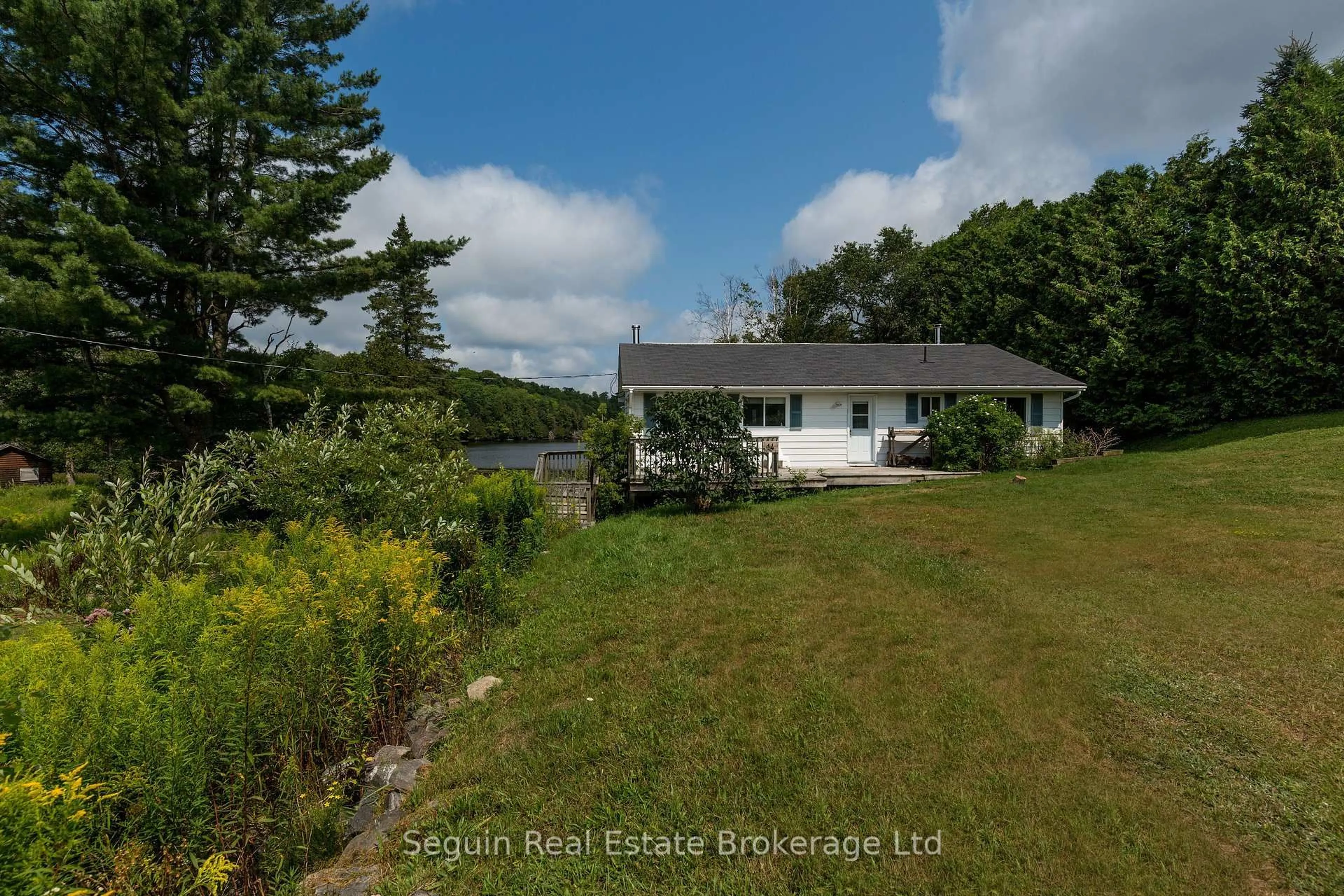 A pic from outside/outdoor area/front of a property/back of a property/a pic from drone, water/lake/river/ocean view for 14 Jordan Lane, Seguin Ontario P2A 0B2