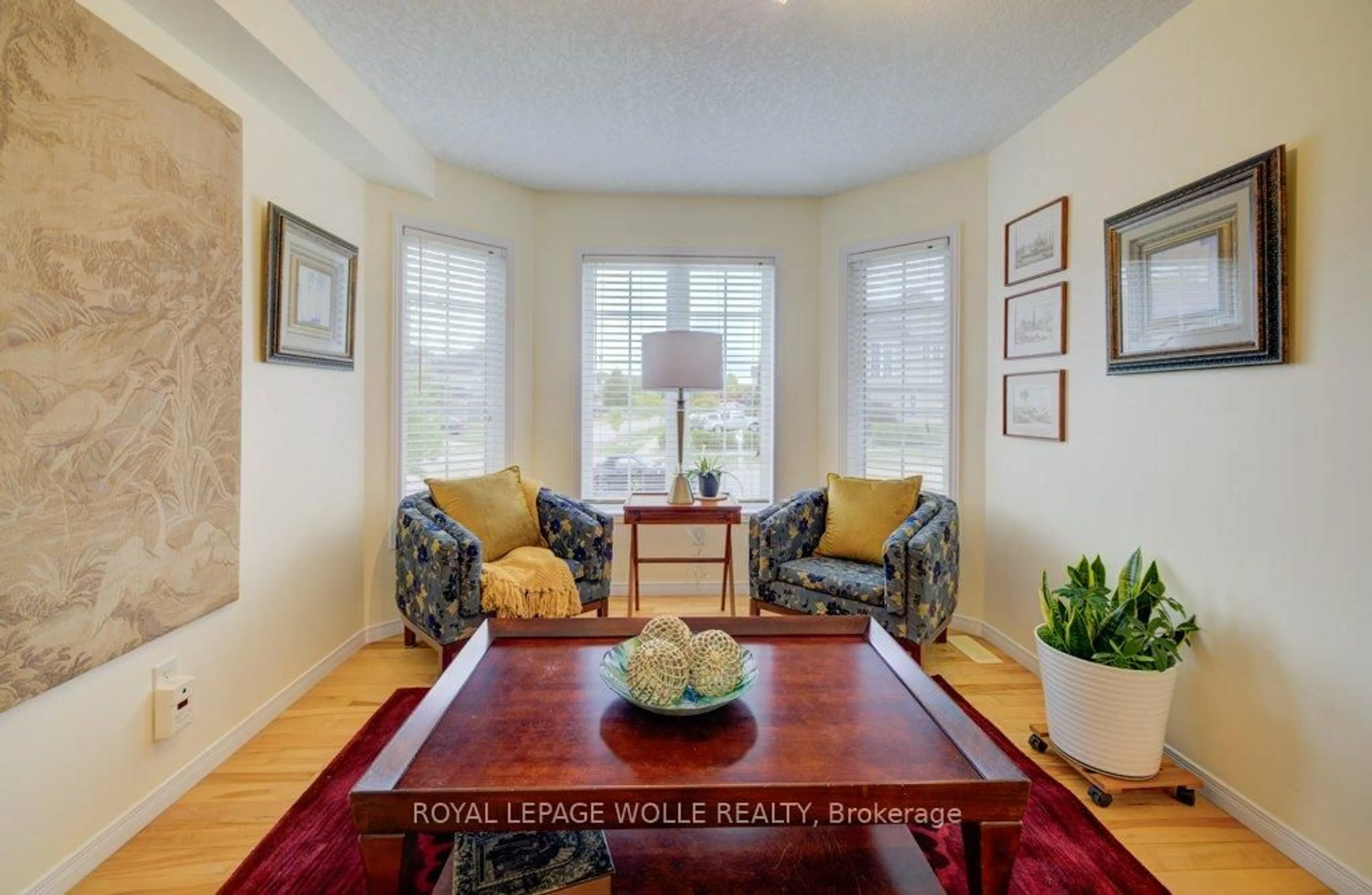 Living room with furniture, wood/laminate floor for 704 Shediac Cres, Waterloo Ontario N2K 4H5
