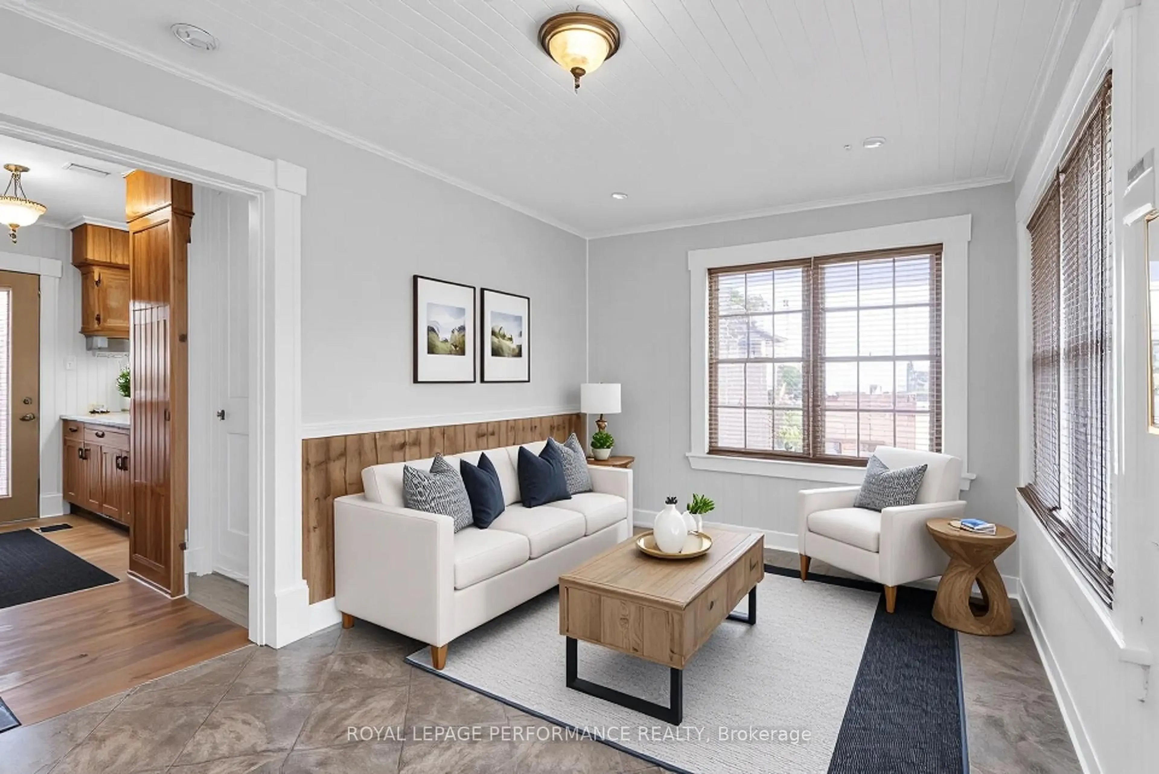 Living room with furniture, wood/laminate floor for 303 Fifth St, Cornwall Ontario K6H 2L9