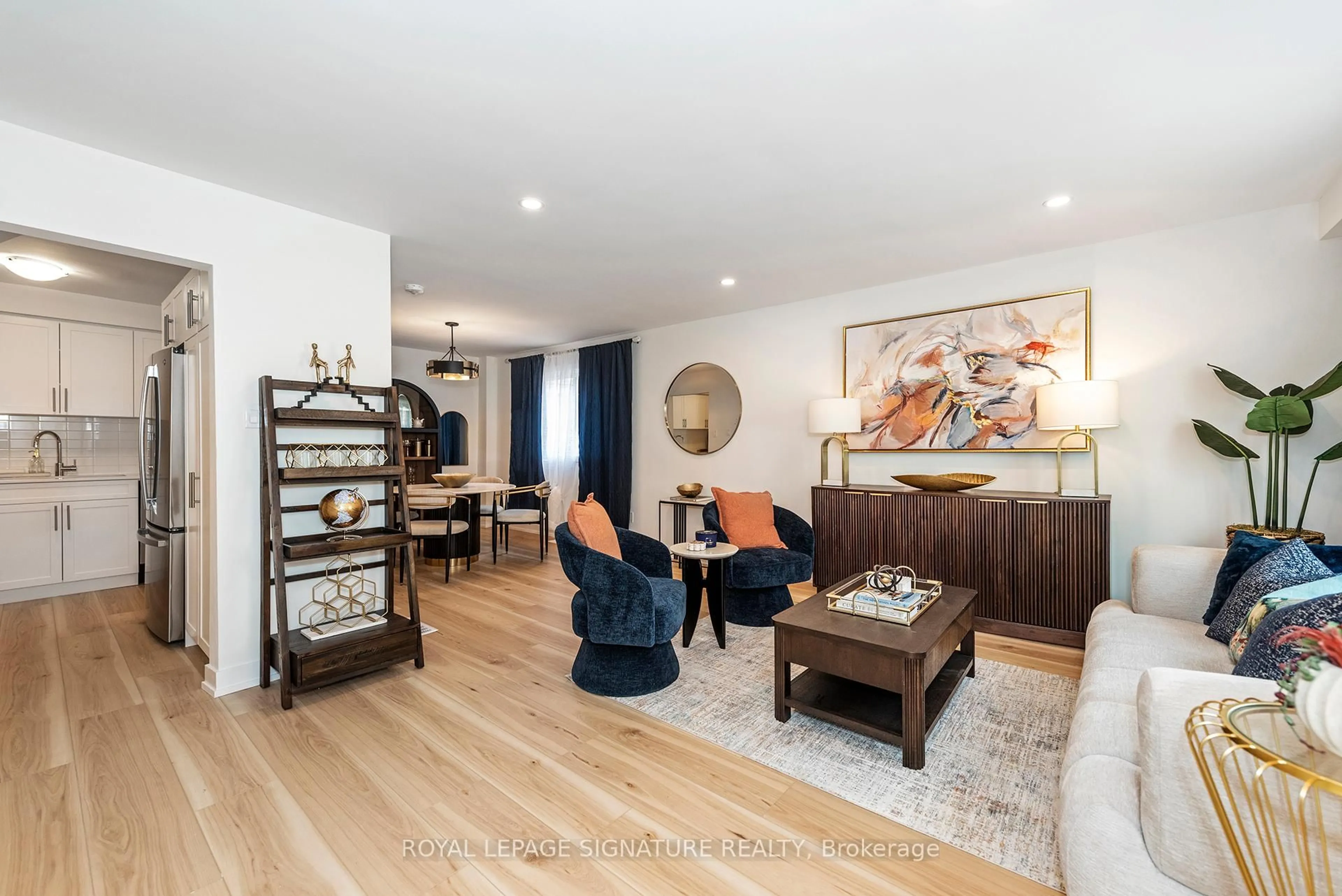 Living room with furniture, wood/laminate floor for 34-36 Delawana Dr, Hamilton Ontario L8E 1G4