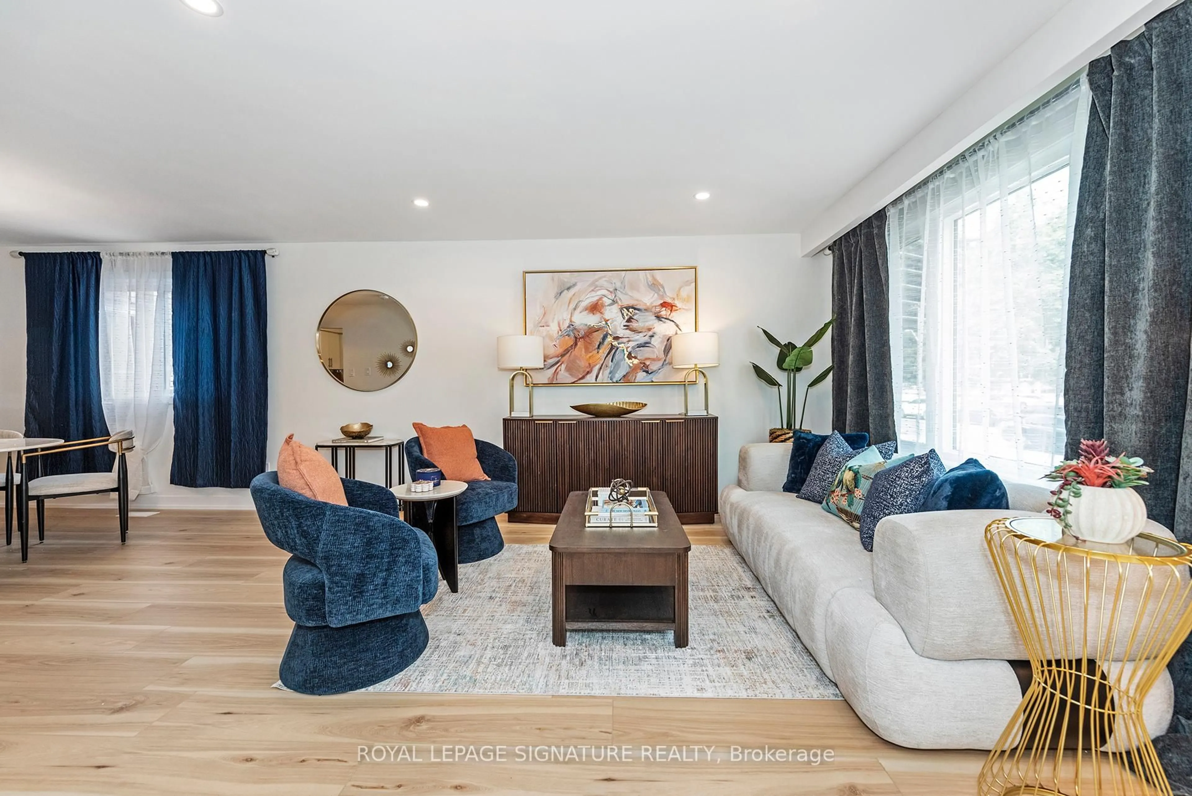 Living room with furniture, wood/laminate floor for 34-36 Delawana Dr, Hamilton Ontario L8E 1G4
