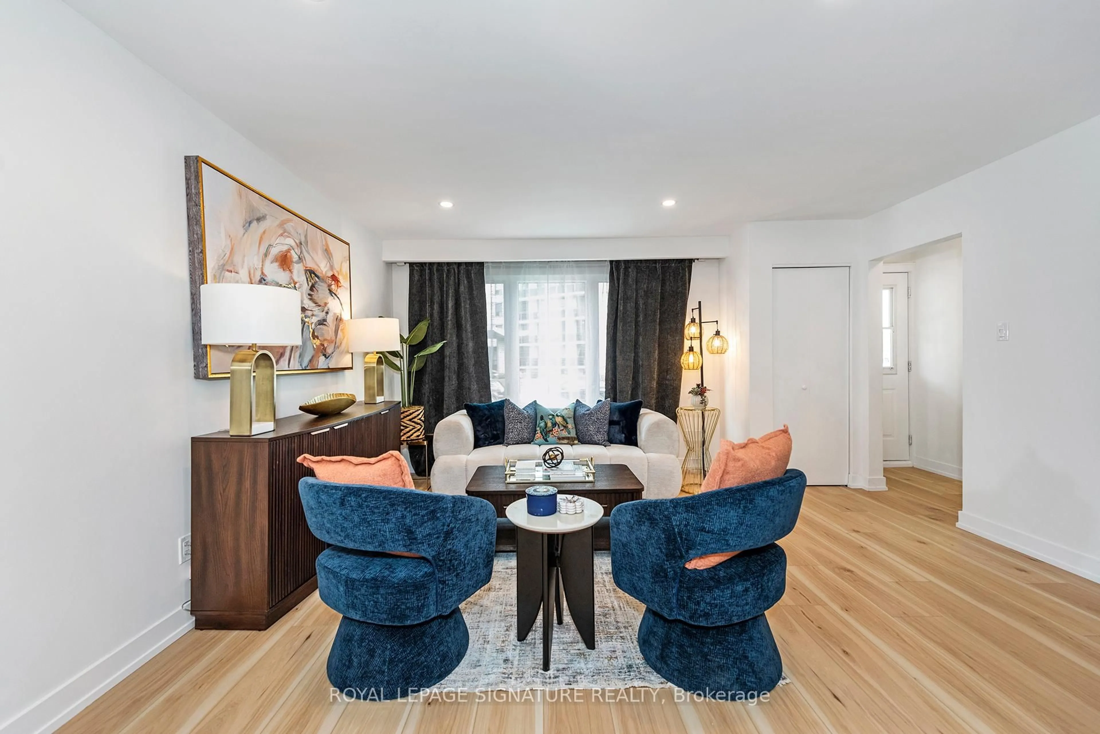 Living room with furniture, wood/laminate floor for 34-36 Delawana Dr, Hamilton Ontario L8E 1G4