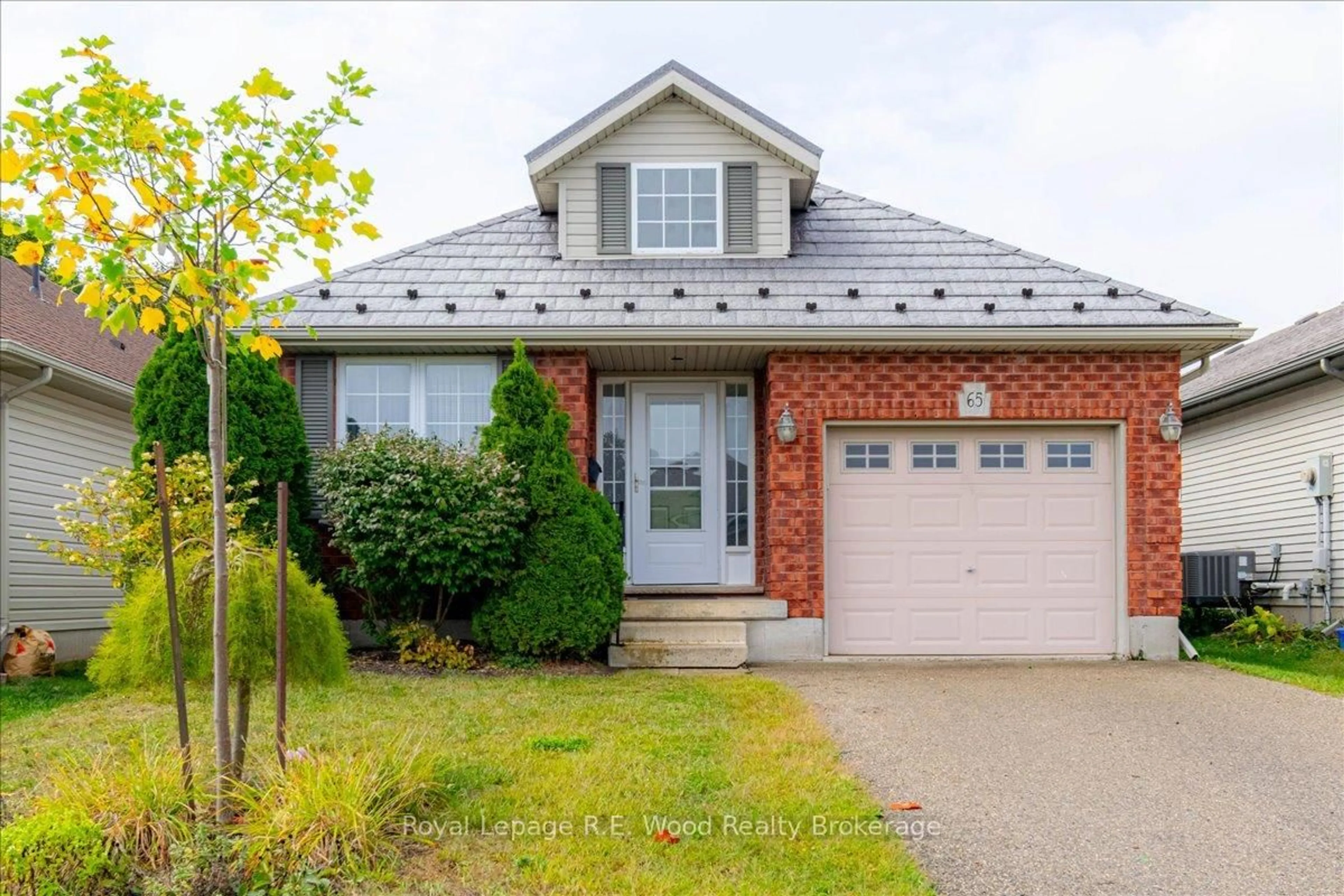Home with brick exterior material, street for 65 Barker St, Tillsonburg Ontario N4G 5N7