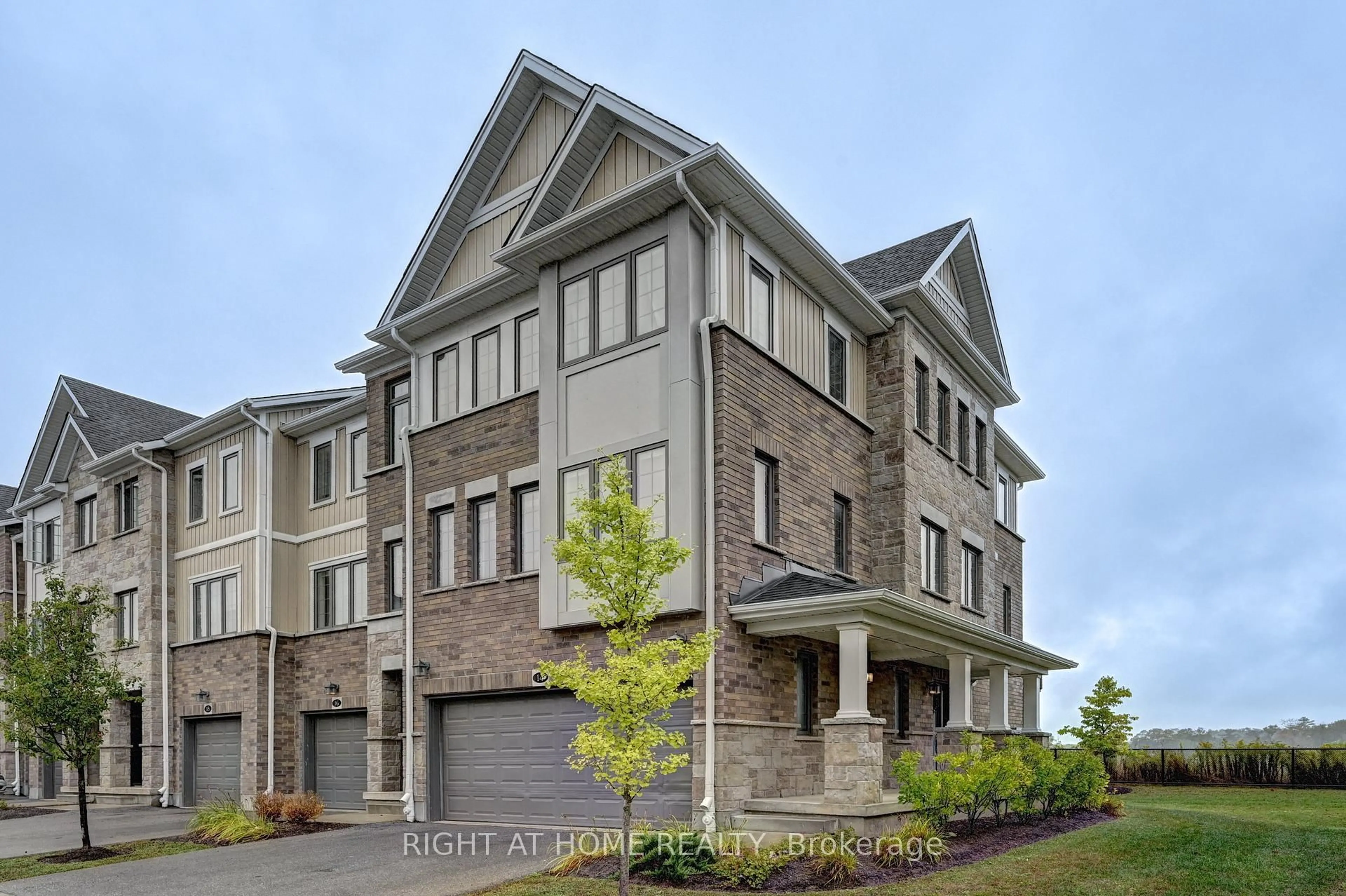 Home with brick exterior material, street for 14 Bank Swallow Cres, Kitchener Ontario N2P 0J7