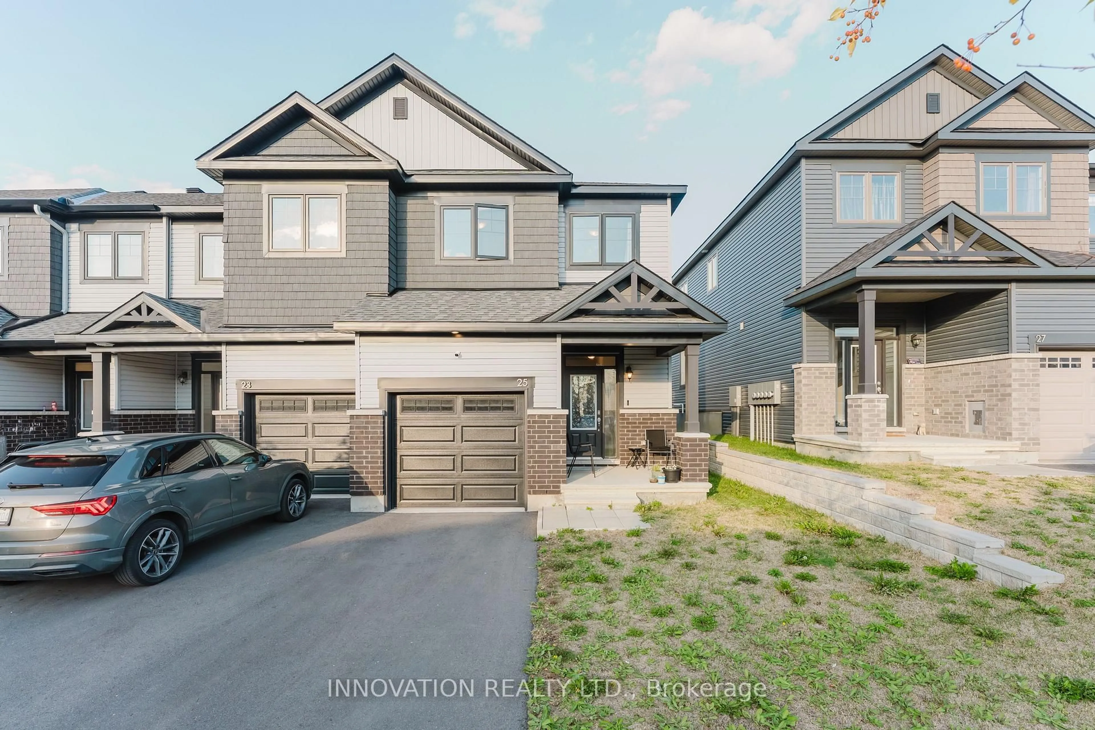 Home with brick exterior material, street for 25 Atop Lane, Ottawa Ontario K1X 1G6