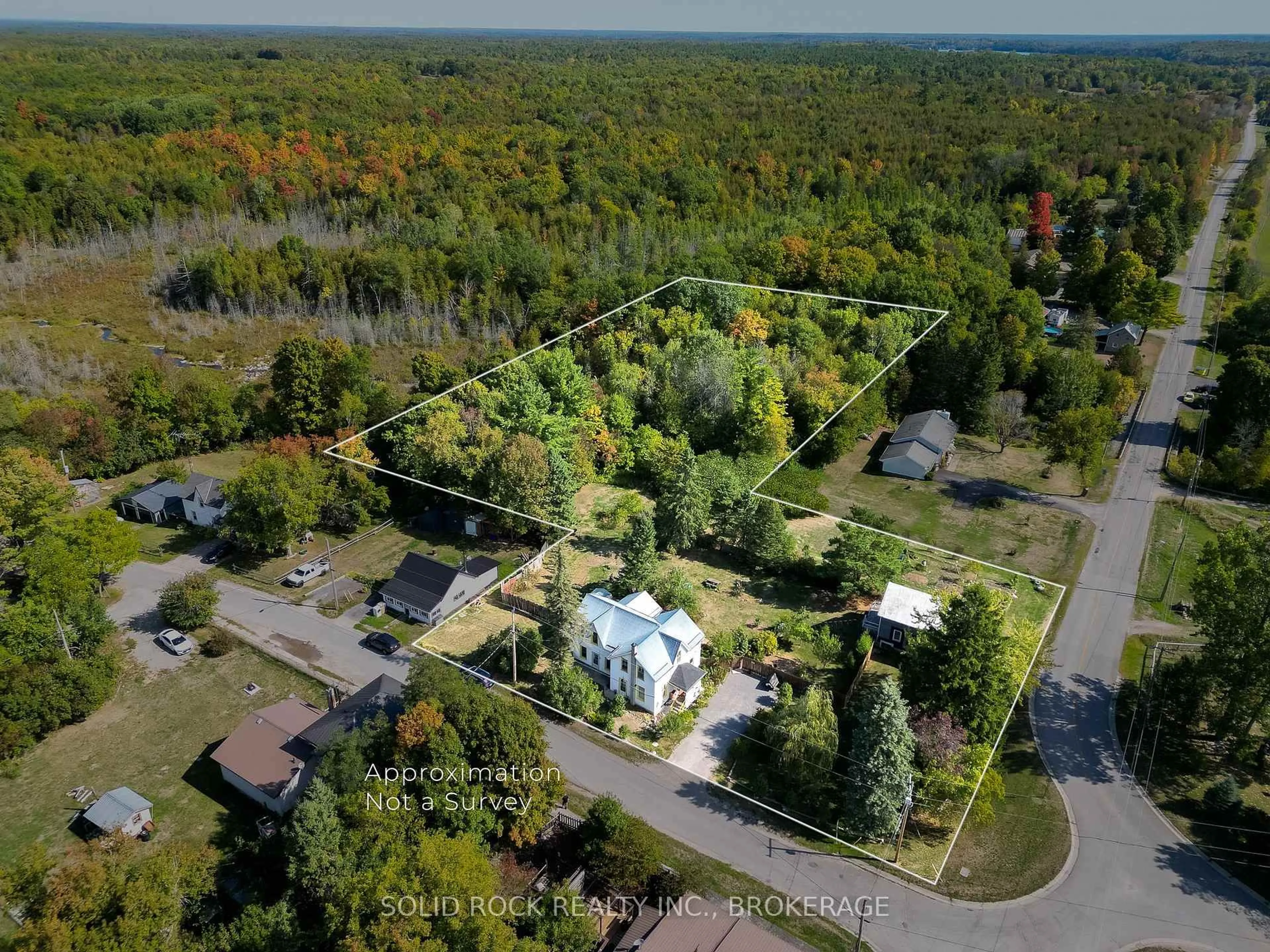 A pic from outside/outdoor area/front of a property/back of a property/a pic from drone, forest/trees view for 108 Queen St, Tweed Ontario K0L 2L0