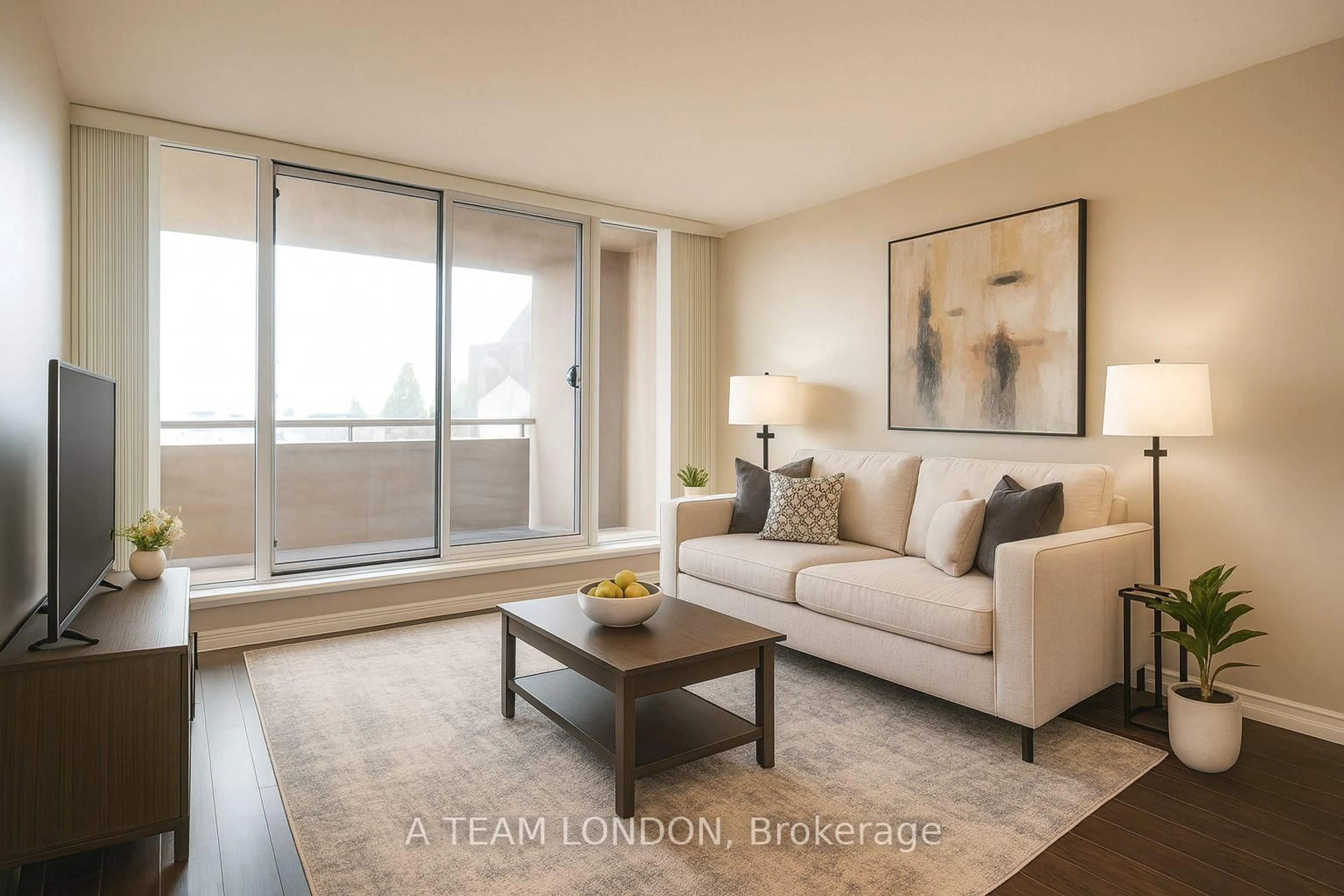 Living room with furniture, wood/laminate floor for 155 KENT St #407, London East Ontario N6A 5N7